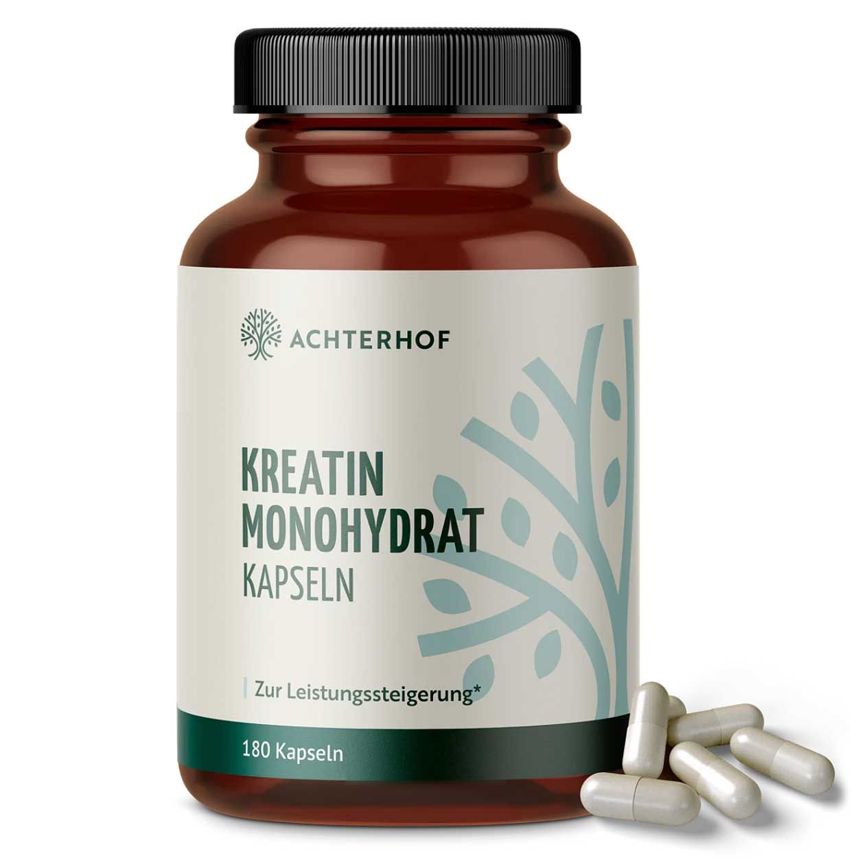 Braune Flasche mit schwarzen Deckel. Aufschrift: Kreatin Monohydrat Kapseln. 180 Kapseln. Einige Kapseln liegen daneben.
