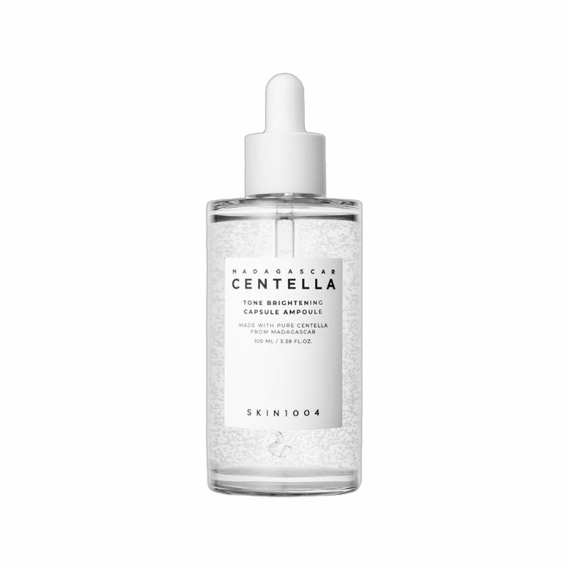 Klare Glasflasche mit weißem Deckel und Pipette. Produktetikett mit Text. Auf weißem Hintergrund.