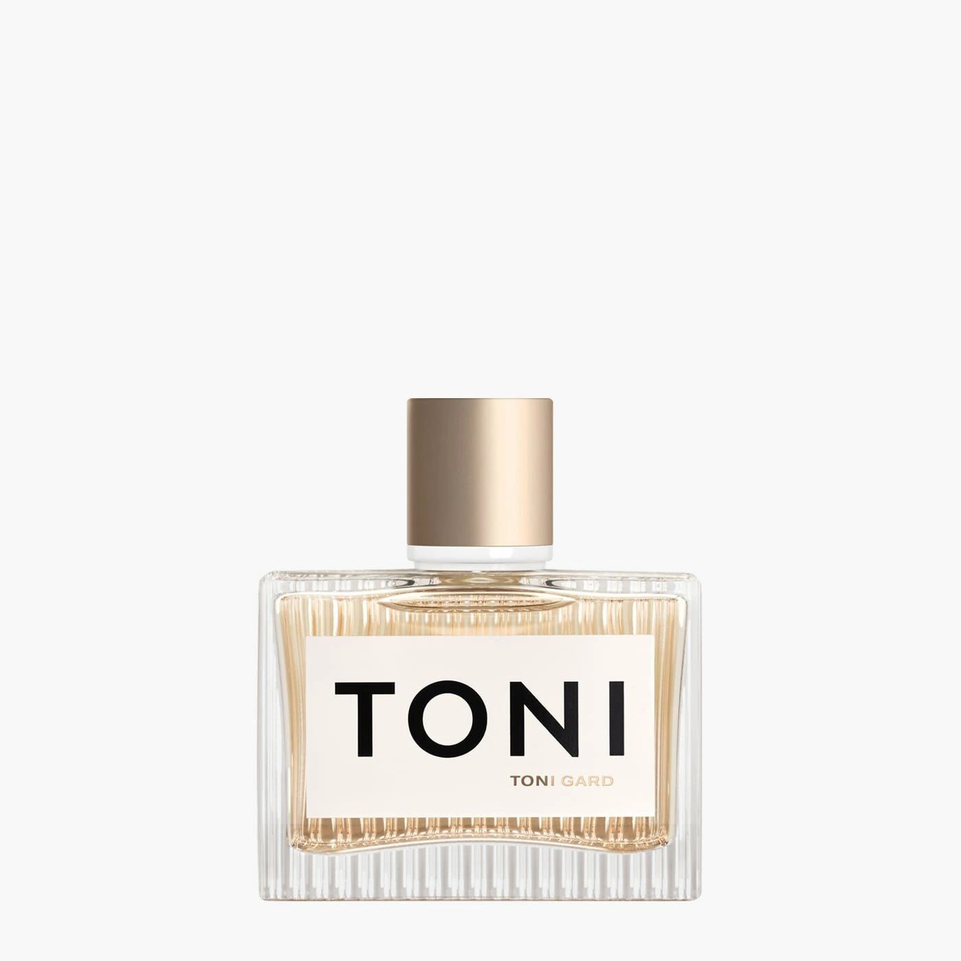 Toni Gard Eau de Parfum Flakon. Rechteckige Glasflasche mit goldfarbenem Verschluss. Aufschrift TONI und TONI GARD.