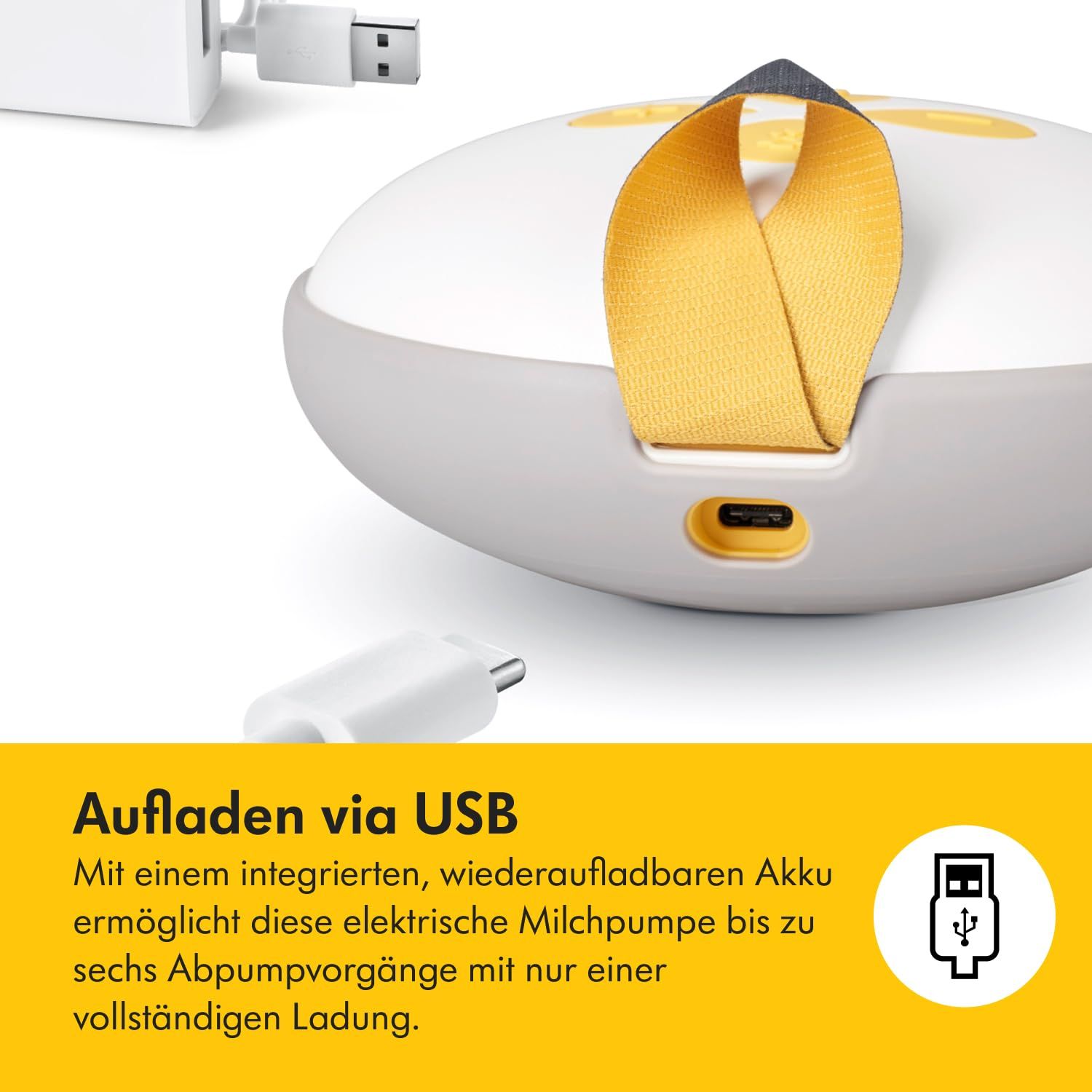 Nahaufnahme eines weißen, elektrischen Milchpumpen-Steuergeräts mit USB-Anschluss. Text: Aufladen via USB.