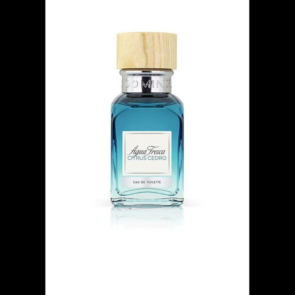 Flakon mit blauem Inhalt und Holzdeckel. Aufschrift: Agua Fresca Citrus Cedro. Eau de Toilette.
