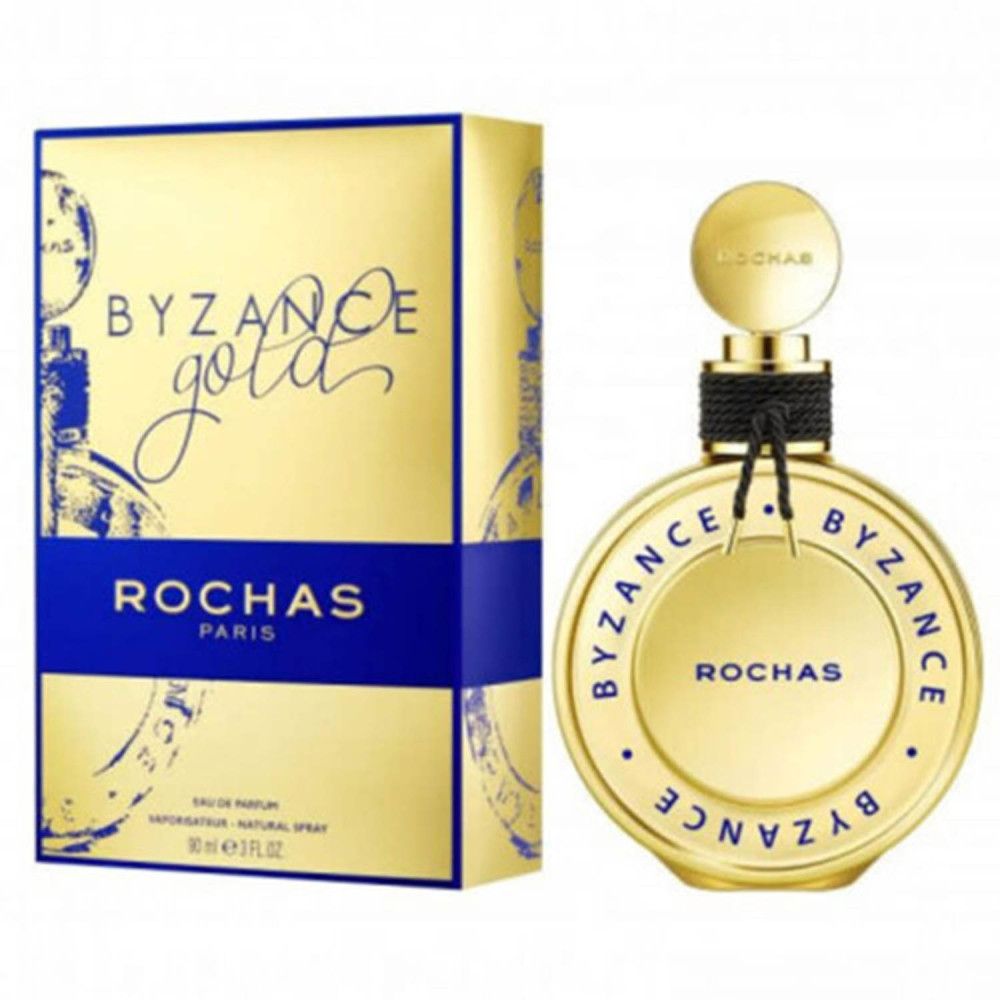 Rochas Byzance Gold Eau de Parfum Flakon und goldene Schachtel mit blauen Akzenten.