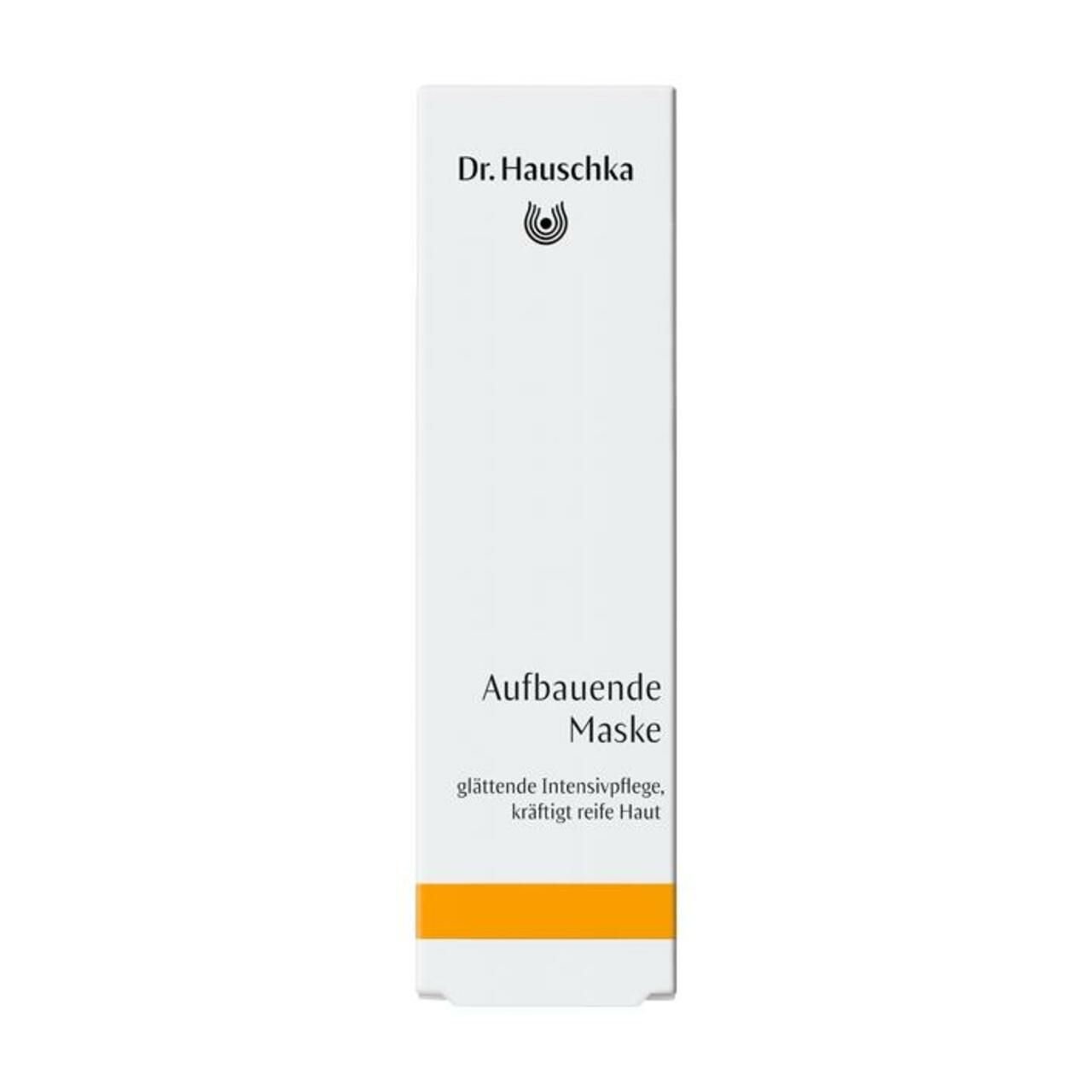 Weiße Schachtel mit gelbem Streifen. Aufschrift: Dr. Hauschka, Aufbauende Maske.