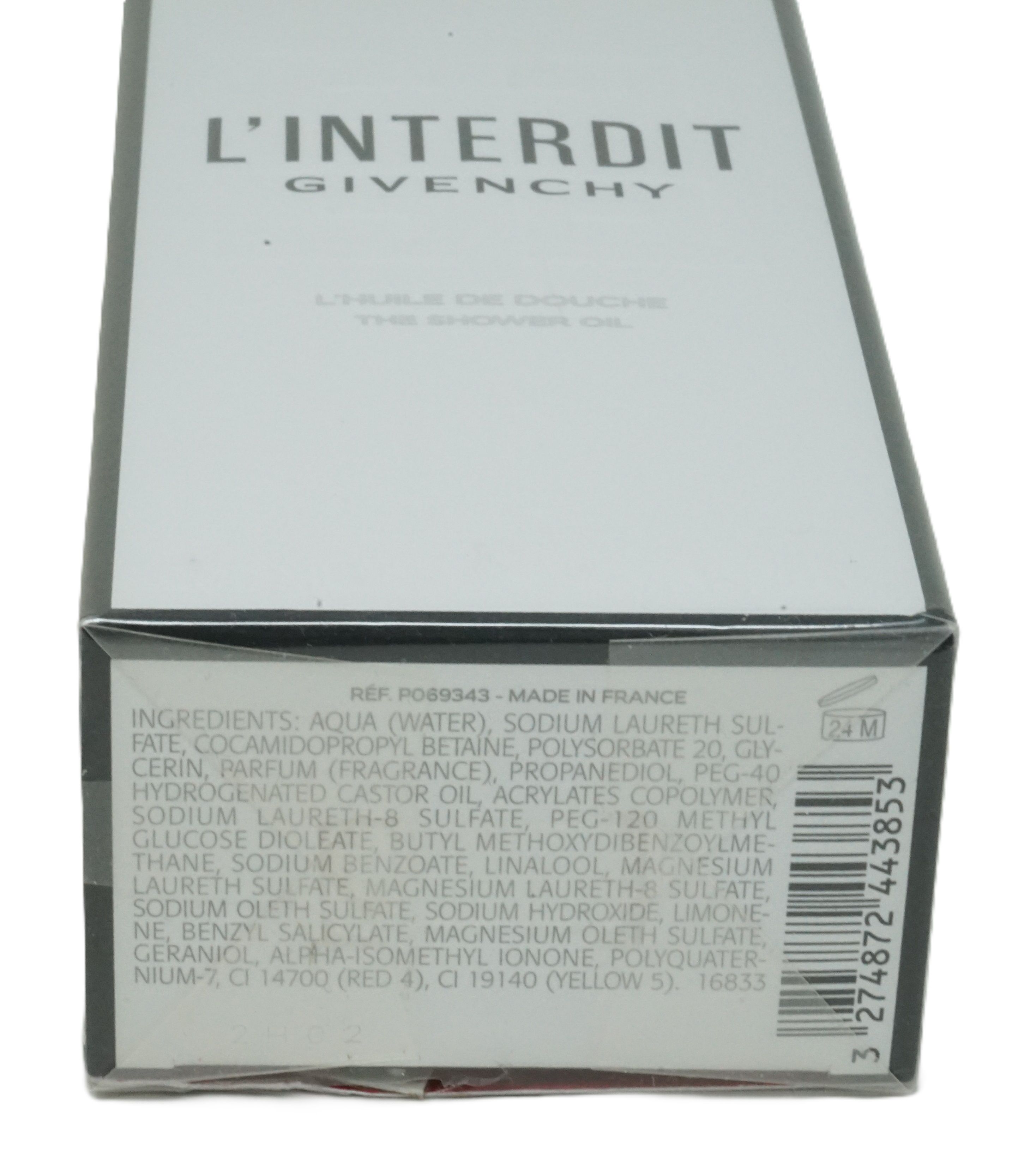 Weißer Karton mit schwarzer Schrift. L'Interdit, Givenchy. Aufschrift: L'Huile de Douche, The Shower Oil. Zutatenliste.