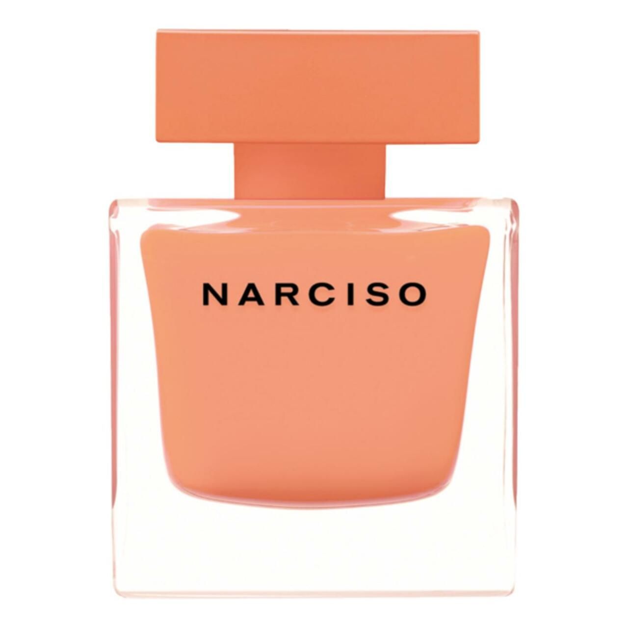 Quadratischer Flakon von Narciso Rodriguez. Orangefarbenes Glas, schwarzer Schriftzug. Deckel und Sprühkopf orange.