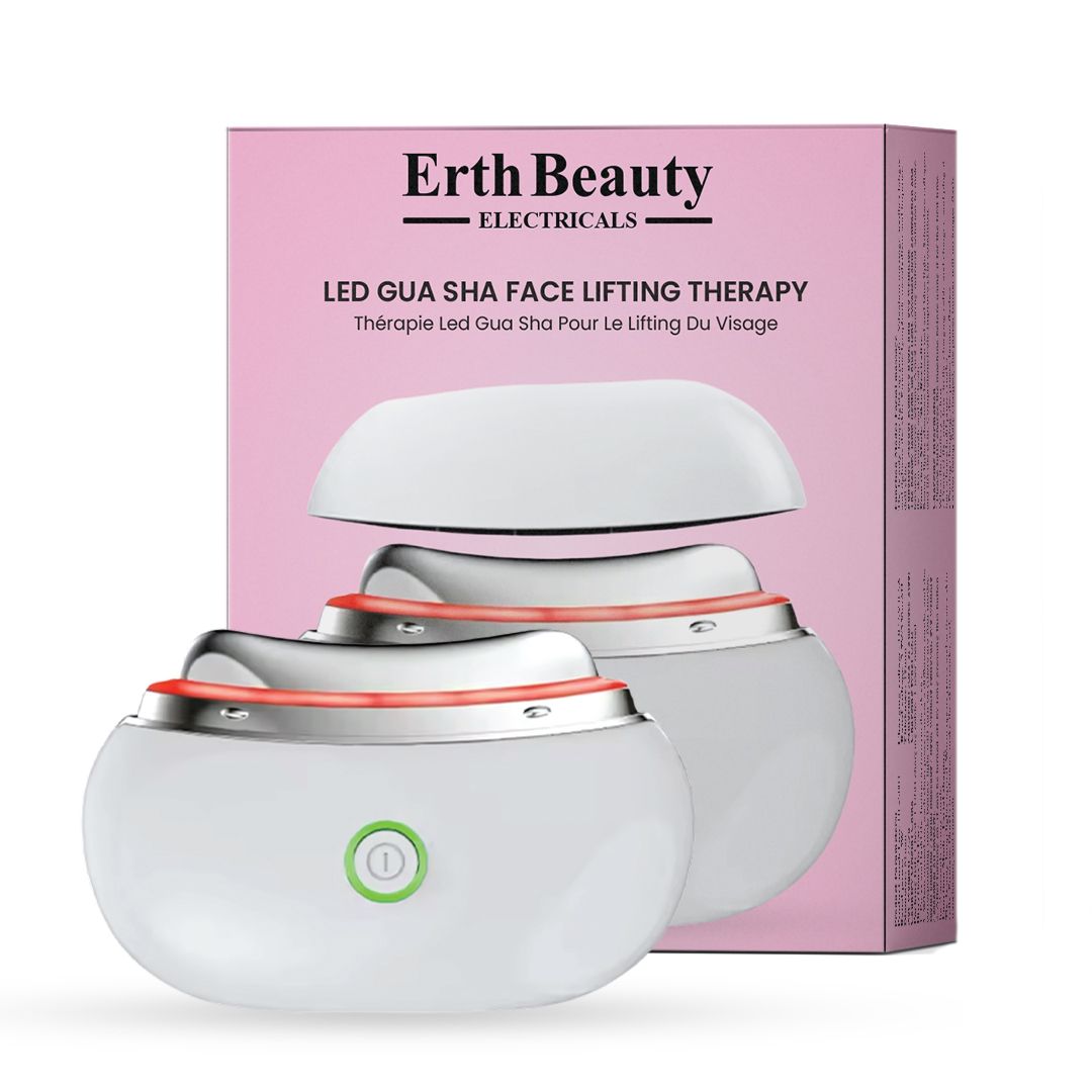 Weißes LED Gua Sha Gesichtslifting-Therapiegerät mit rosa Verpackung. Auf dem Gerät ist ein grüner Einschaltknopf zu sehen.