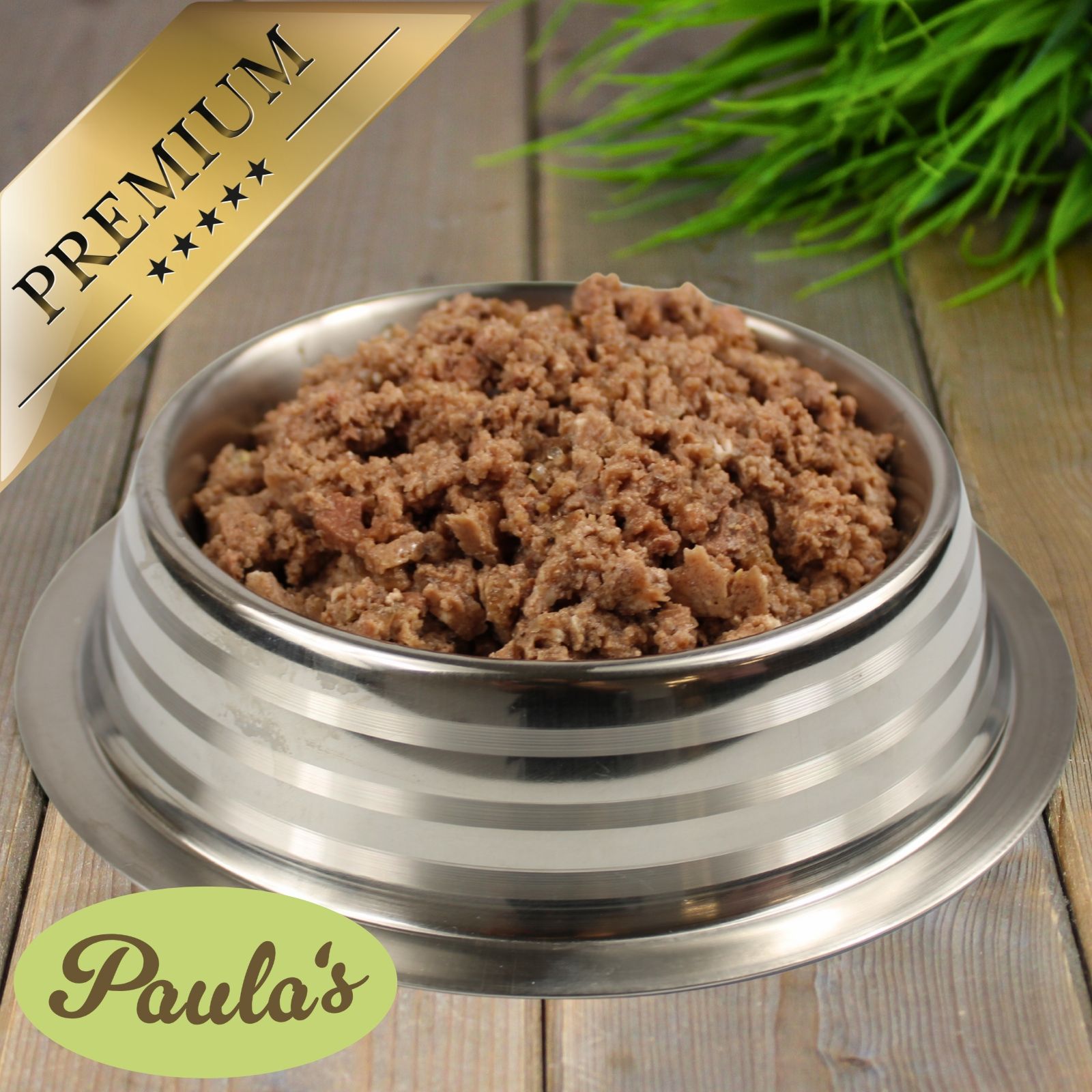 Hundefutter in Edelstahlschale. Logo: Paula's. Auszeichnung: Premium.