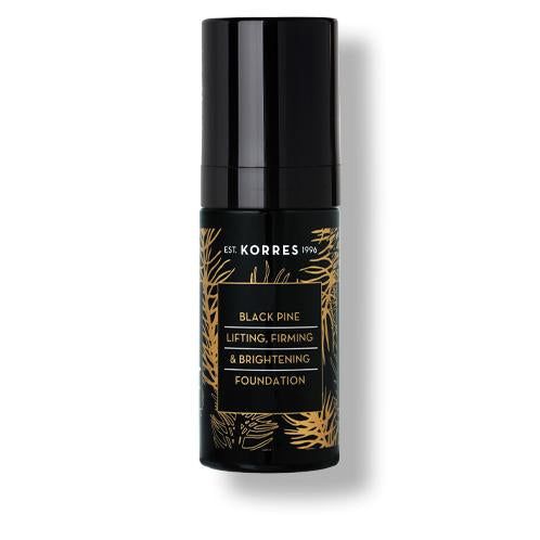 Schwarze Flasche mit Aufschrift 'KORRES Black Pine Foundation'. Goldfarbene Schrift und Verzierungen. Schwarzer Deckel.