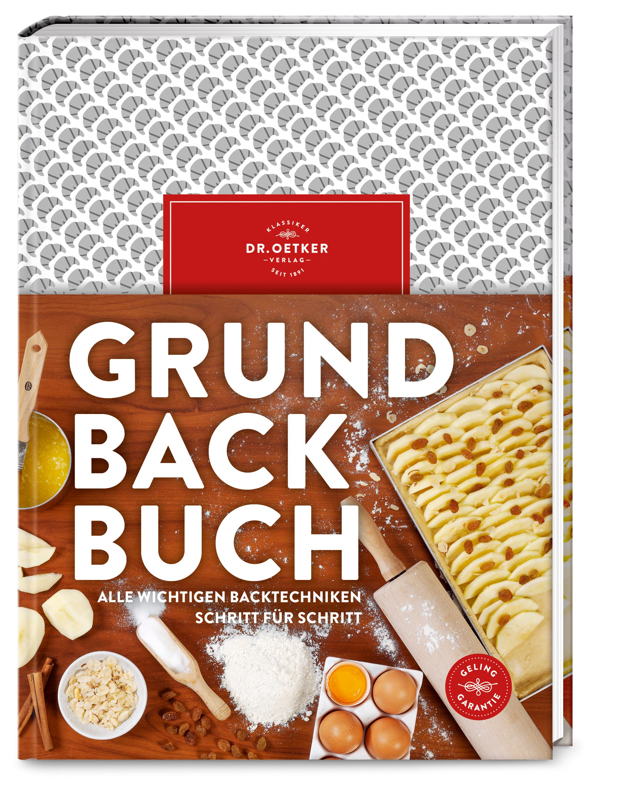 Buch mit dem Titel "Grundbackbuch". Auf dem Cover sind Zutaten und Backutensilien abgebildet. Das Buch hat einen roten Einband mit dem Logo von Dr. Oetker.