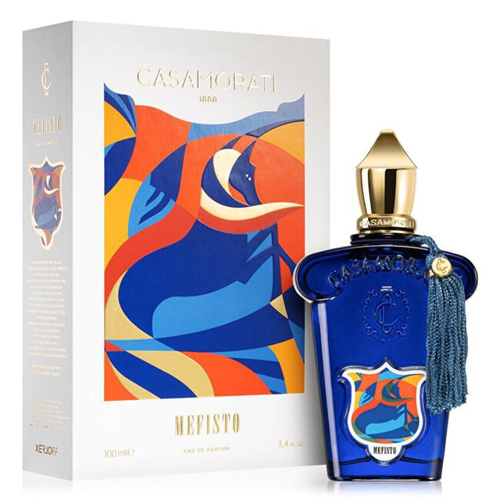 Blaue Flasche mit goldener Kappe und Quaste. Aufschrift Mefisto und Casamorati. Weiße Verpackung mit farbiger Illustration.