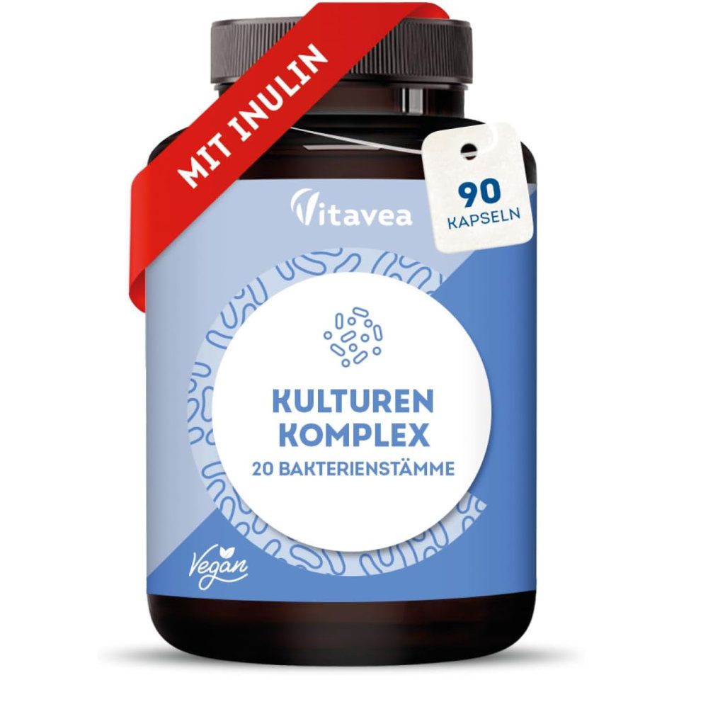 Braune Flasche mit Kapseln. Rotes Band mit "MIT INULIN". Etikett mit "KULTUREN KOMPLEX" und "90 KAPSELN". Vegan-Logo.