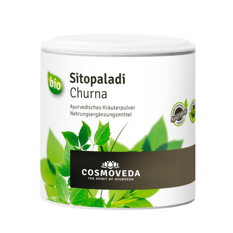 Weißes Dose mit "Cosmoveda - BIO Sitopaladi Churna". Grün-weiße Etikett mit Blättern und Text. Bio-Siegel.