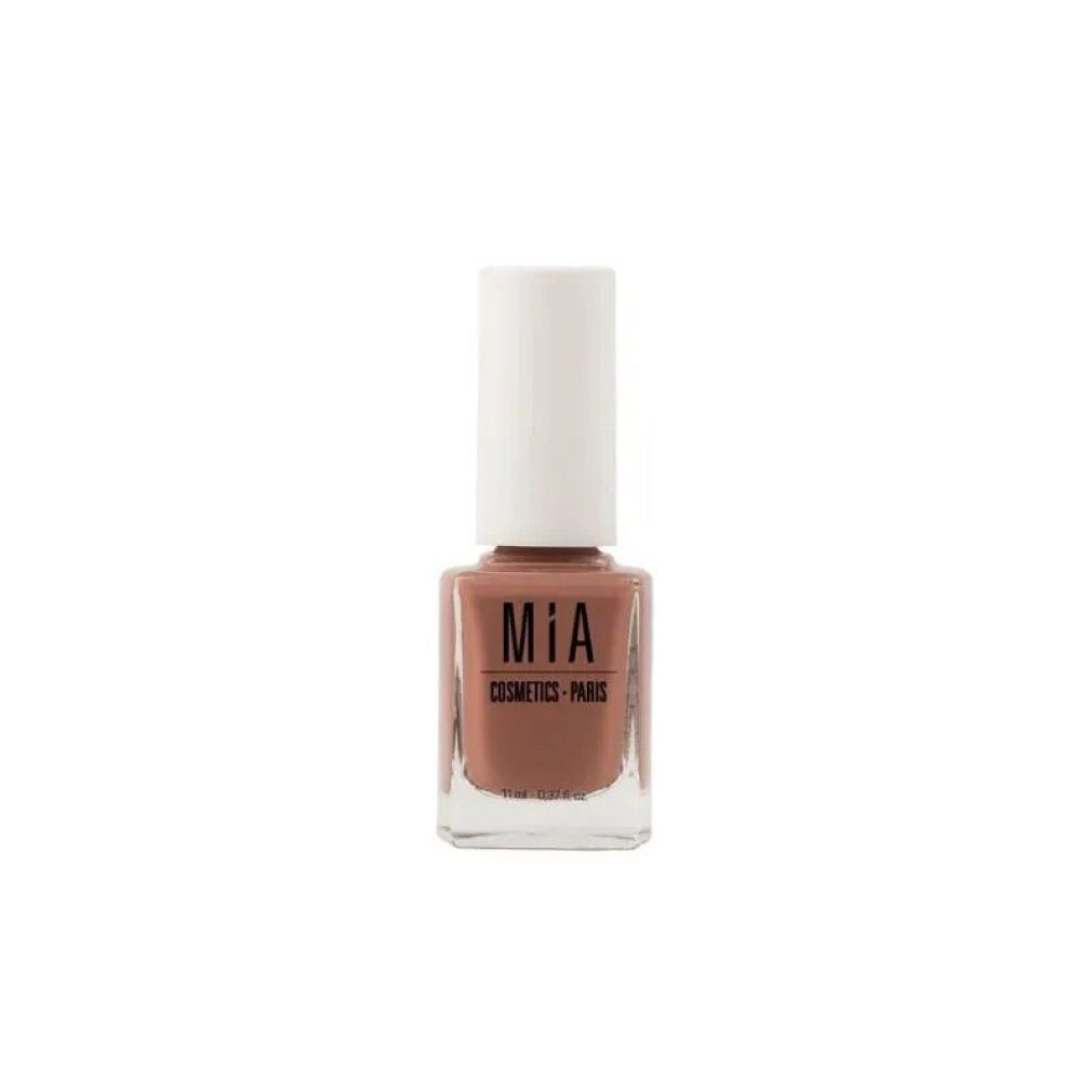 Nagellackflasche mit brauner Farbe und weißem Deckel. Aufschrift: mía Cosmetics - Paris.