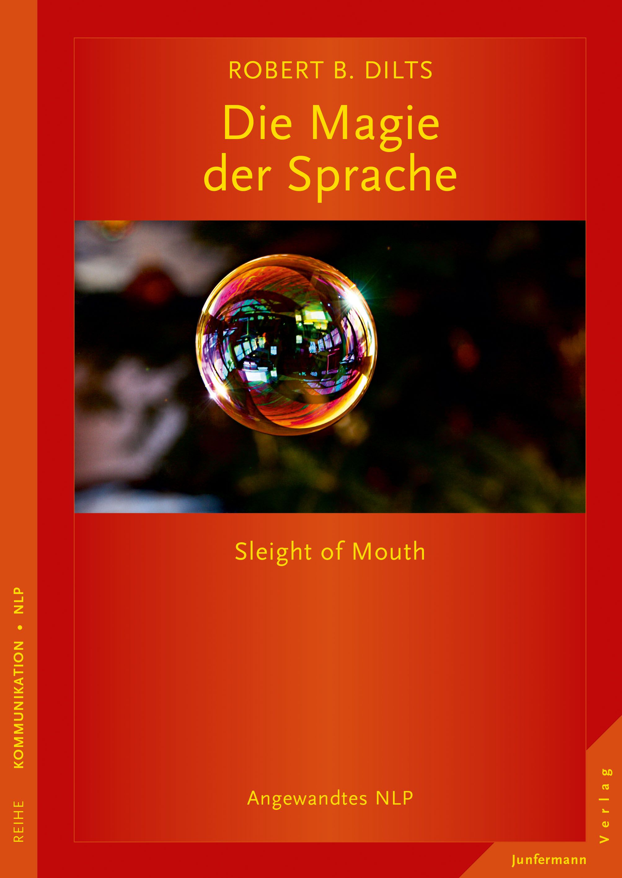Buchcover mit Titel "Die Magie der Sprache" von Robert B. Dilts. Ein Regenbogen-Seifenblase vor rotem Hintergrund.