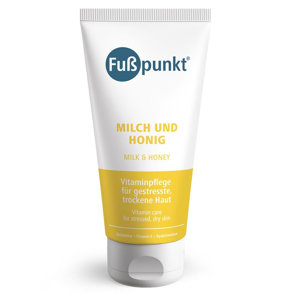 Fußpunkt® MILCH UND HONIG. Weiße Tube mit blauem Logo und gelbem Streifen. Text: Vitaminpflege für gestresste, trockene Haut.
