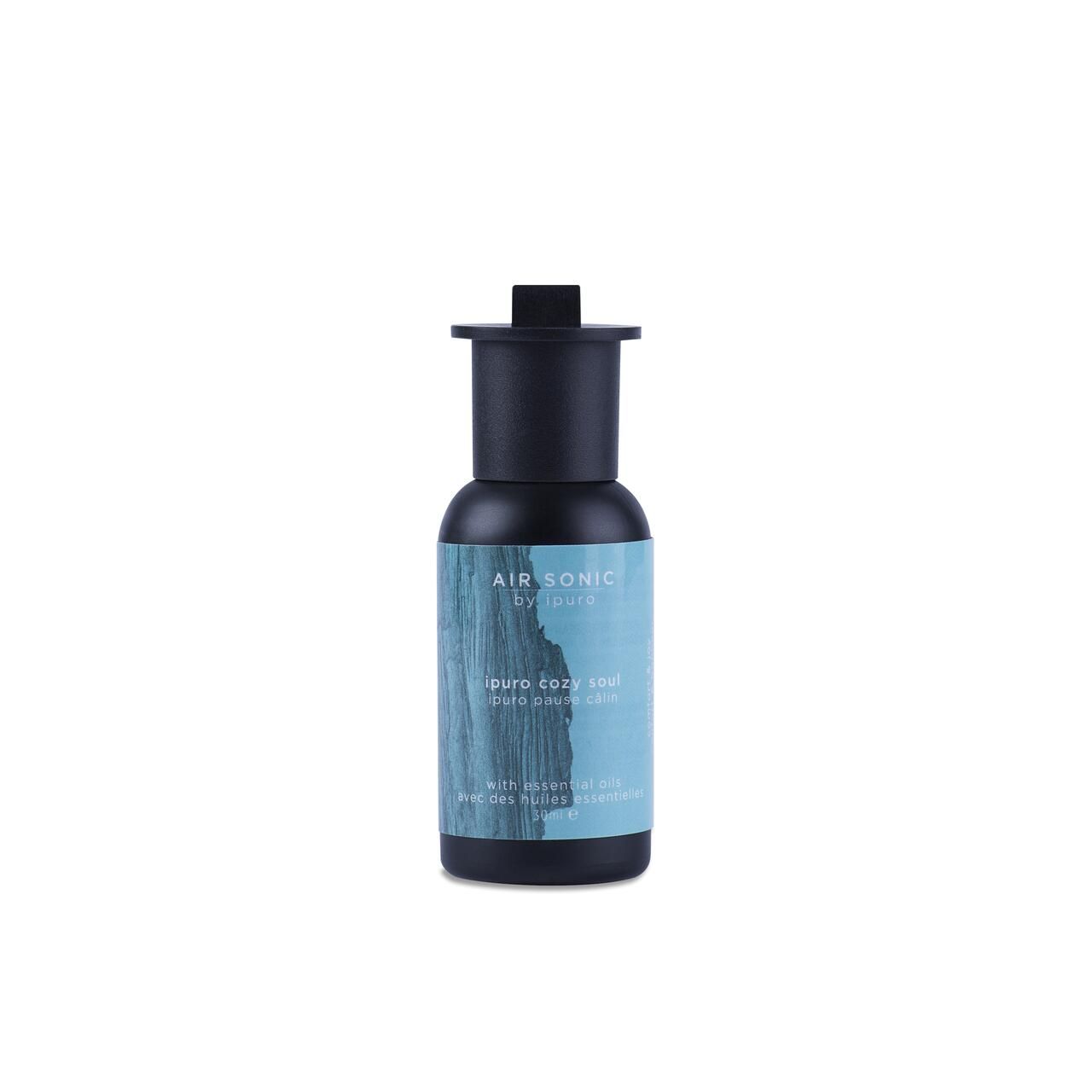 Schwarze Flasche mit blauem Etikett. Text: Air Sonic by Ipuro, Ipuro Cozy Soul. Mit ätherischen Ölen.