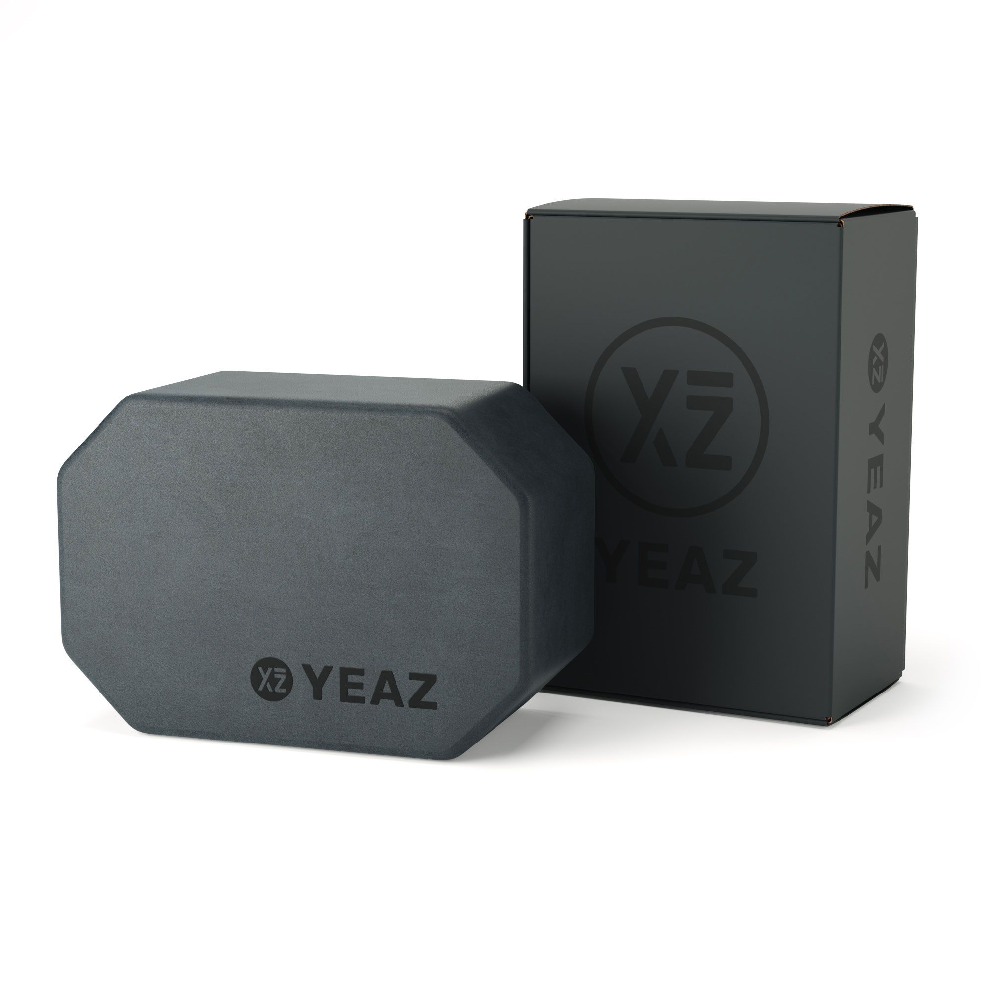 Grauer Yoga-Block und Verpackung. Auf dem Block und der Verpackung ist das YEAZ-Logo zu sehen.