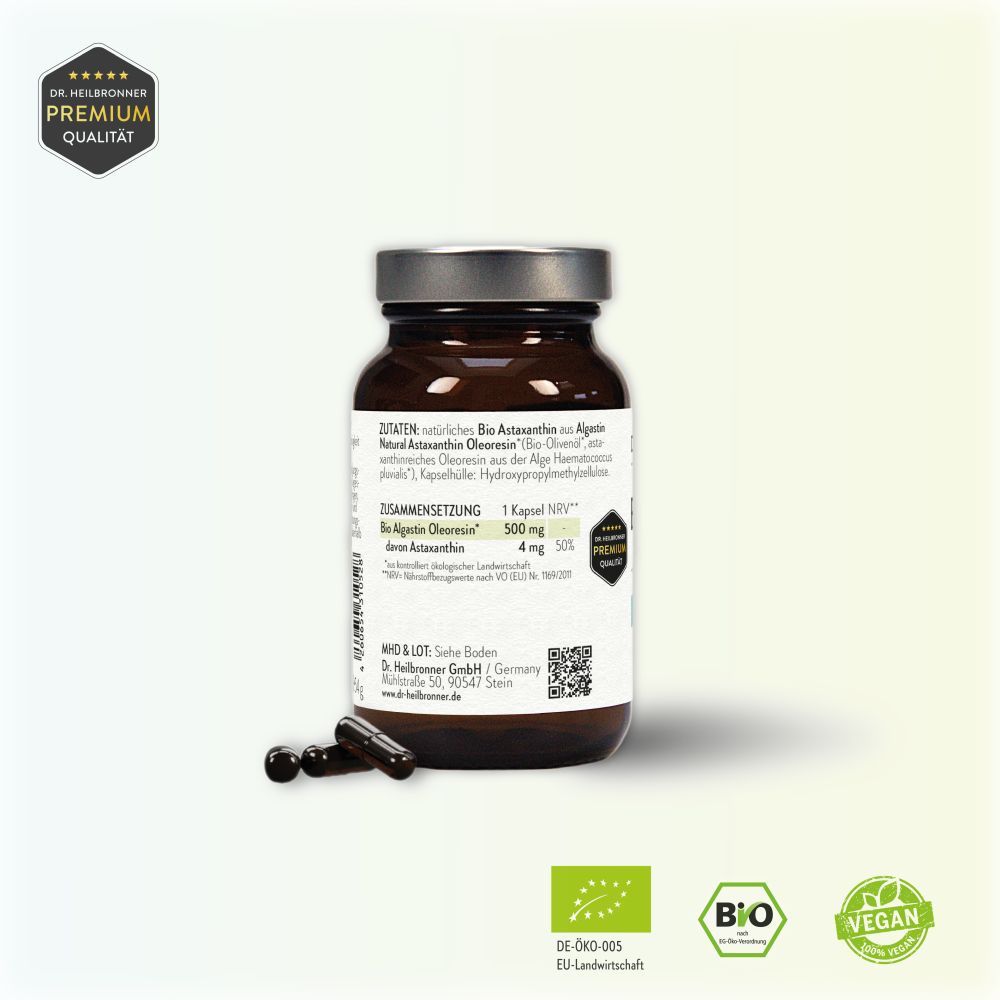 Braune Glasflasche mit Kapseln. Etikett mit Inhaltsstoffen und "Bio Astaxanthin Komplex 4mg". Bio- und Vegan-Siegel.