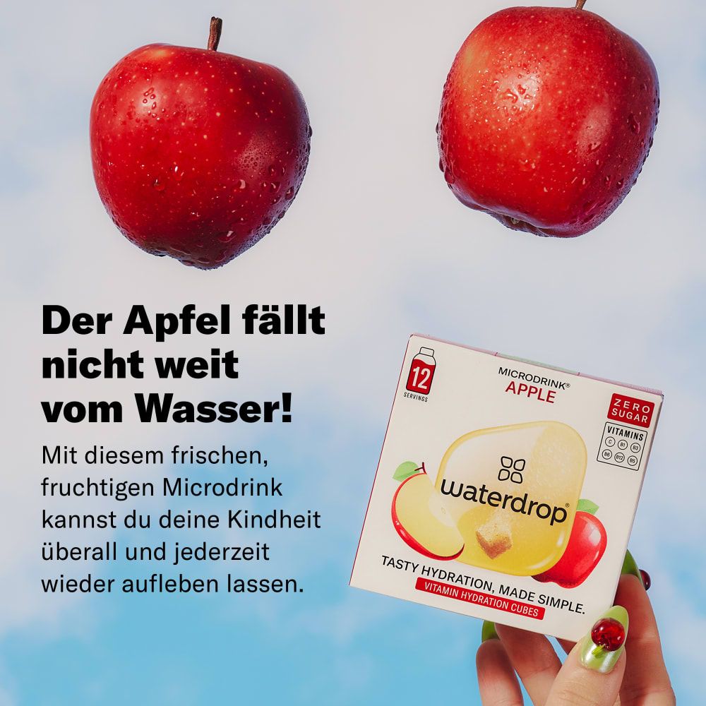 Packung waterdrop® Microdrink Apfel. Aufschrift: 12 Portionen, ohne Zucker, mit Vitaminen. Gehalten von einer Hand mit lackierten Nägeln.