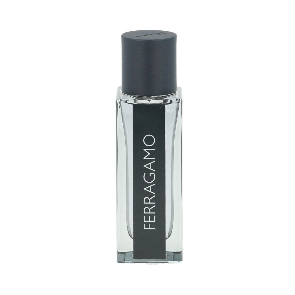 Transparente Flasche mit schwarzem Deckel. Aufschrift: FERRAGAMO. Rechteckige Form.