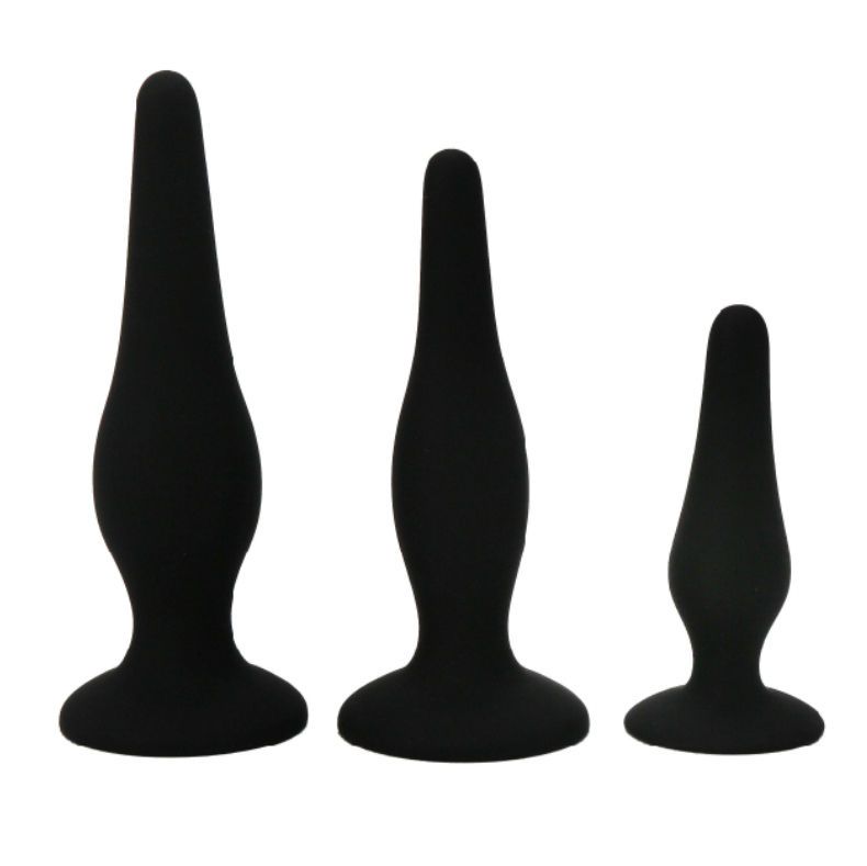 Drei schwarze Silikon-Butt-Plugs in verschiedenen Größen. Konische Form mit breiter Basis.