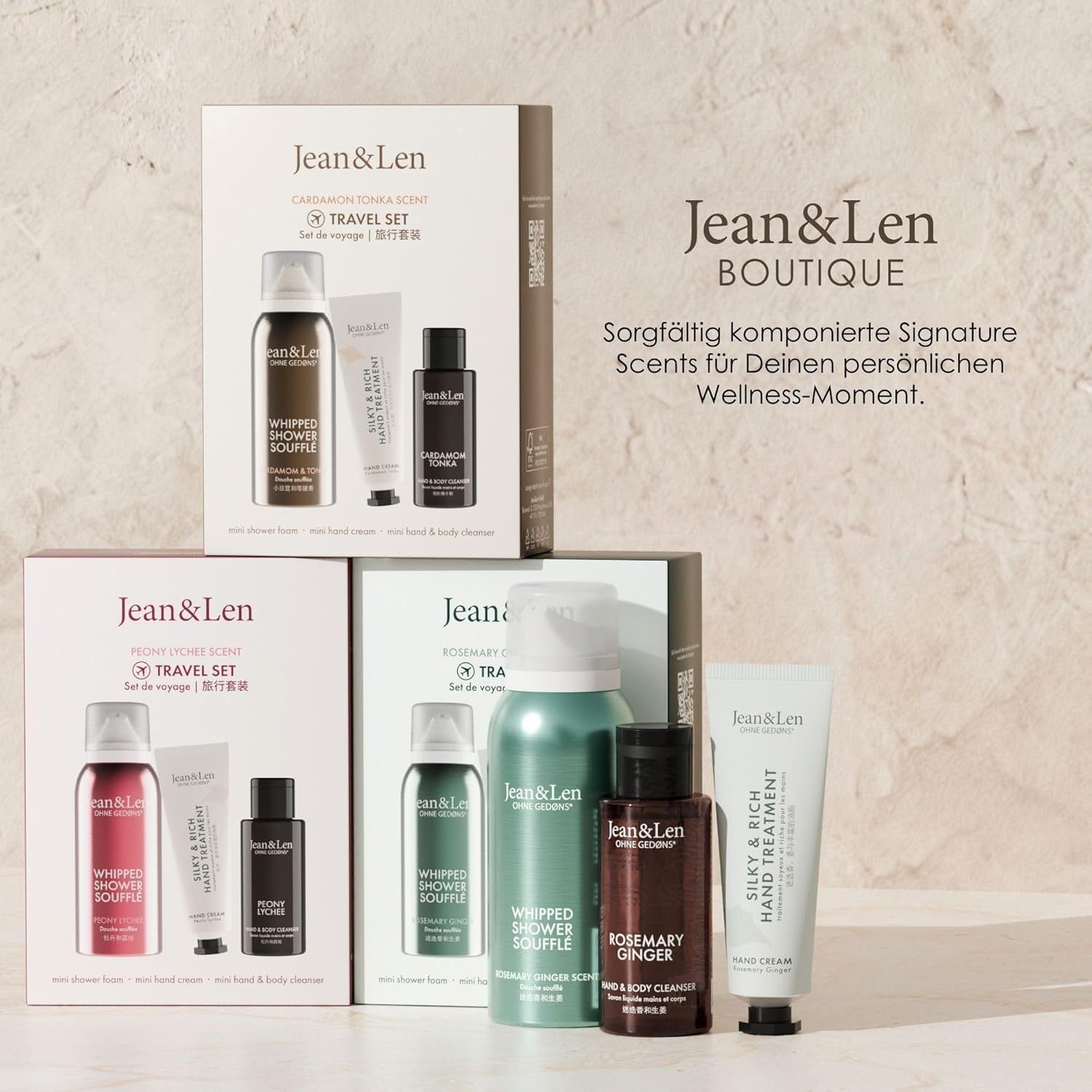 Mehrere Travel Sets mit verschiedenen Düften. Verpackungen mit Produktnamen und Logo. Text: Jean & Len Boutique.