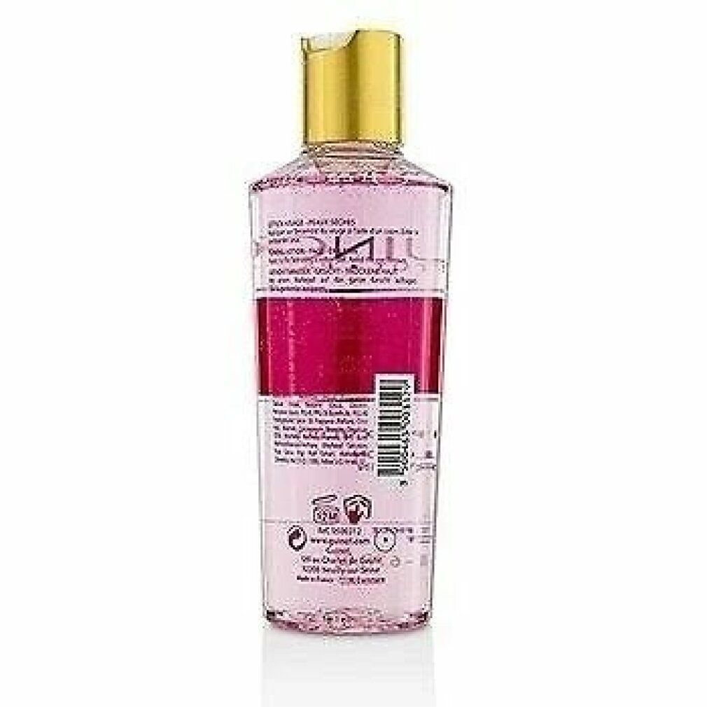 Guinot Hydra Beaute Lotion. Rückansicht der Flasche. Transparente Flasche mit rosa Flüssigkeit, goldfarbenem Deckel. Etiketten.