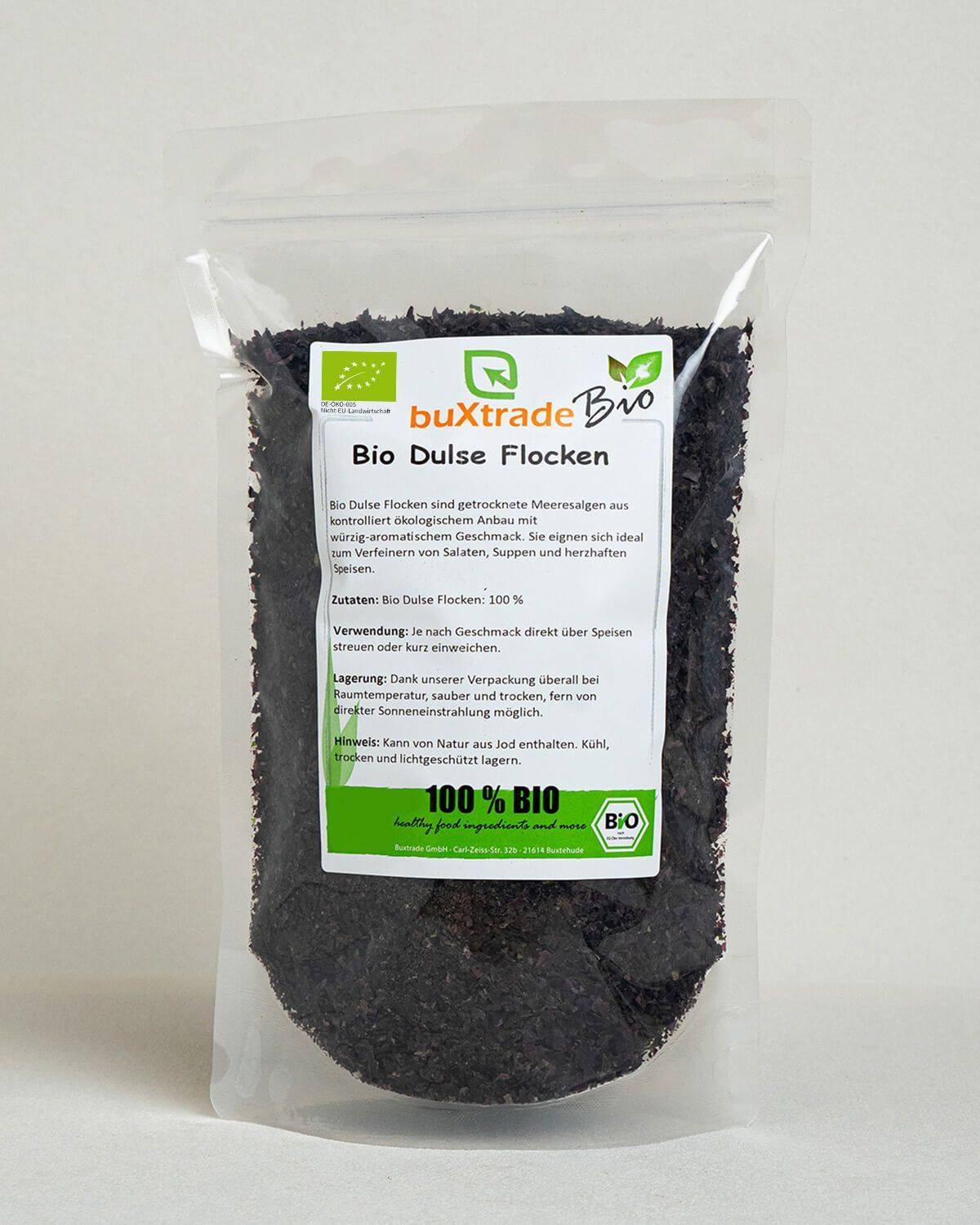Buxtrade Bio Dulse Flocken in einem wiederverschließbaren Beutel. Dunkle Flocken mit Bio-Siegel.