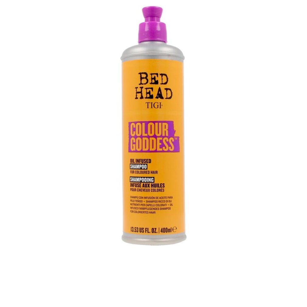 Zylindrische Flasche mit lila Pumpe. Aufschrift: Bed Head Tigi Colour Goddess Shampoo. Orangefarbener Hintergrund.