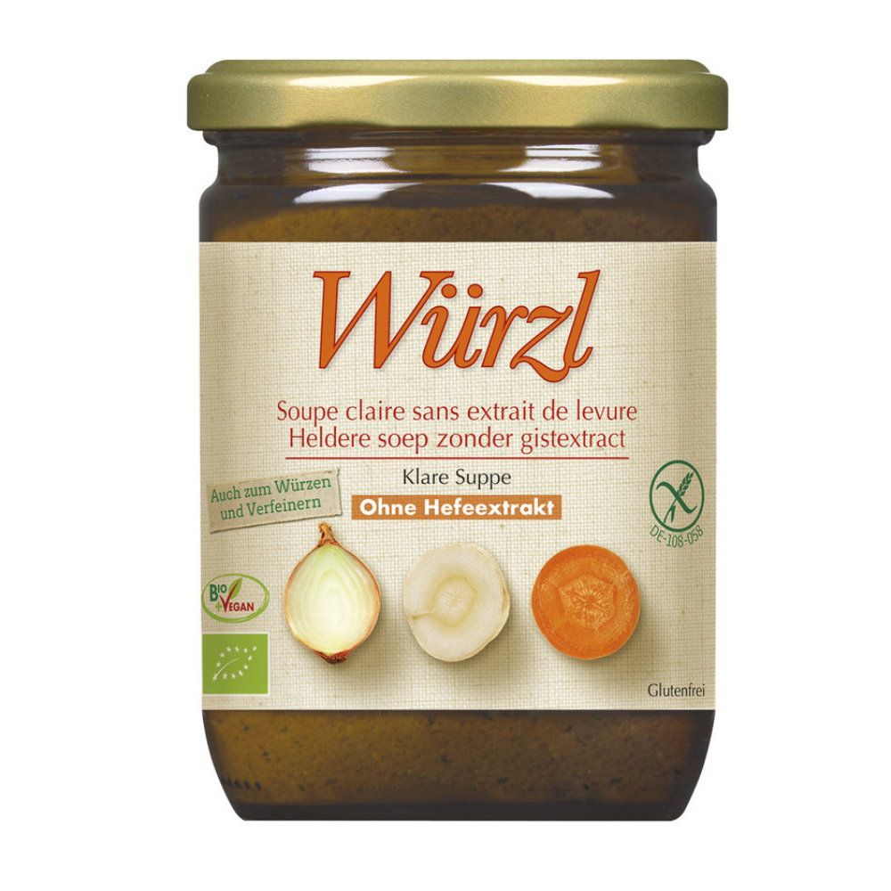 Glas mit klarer Suppe. Aufschrift: Würzl, Klare Suppe, ohne Hefeextrakt. Abbildung von Gemüse. Vegan- und Glutenfrei-Siegel.
