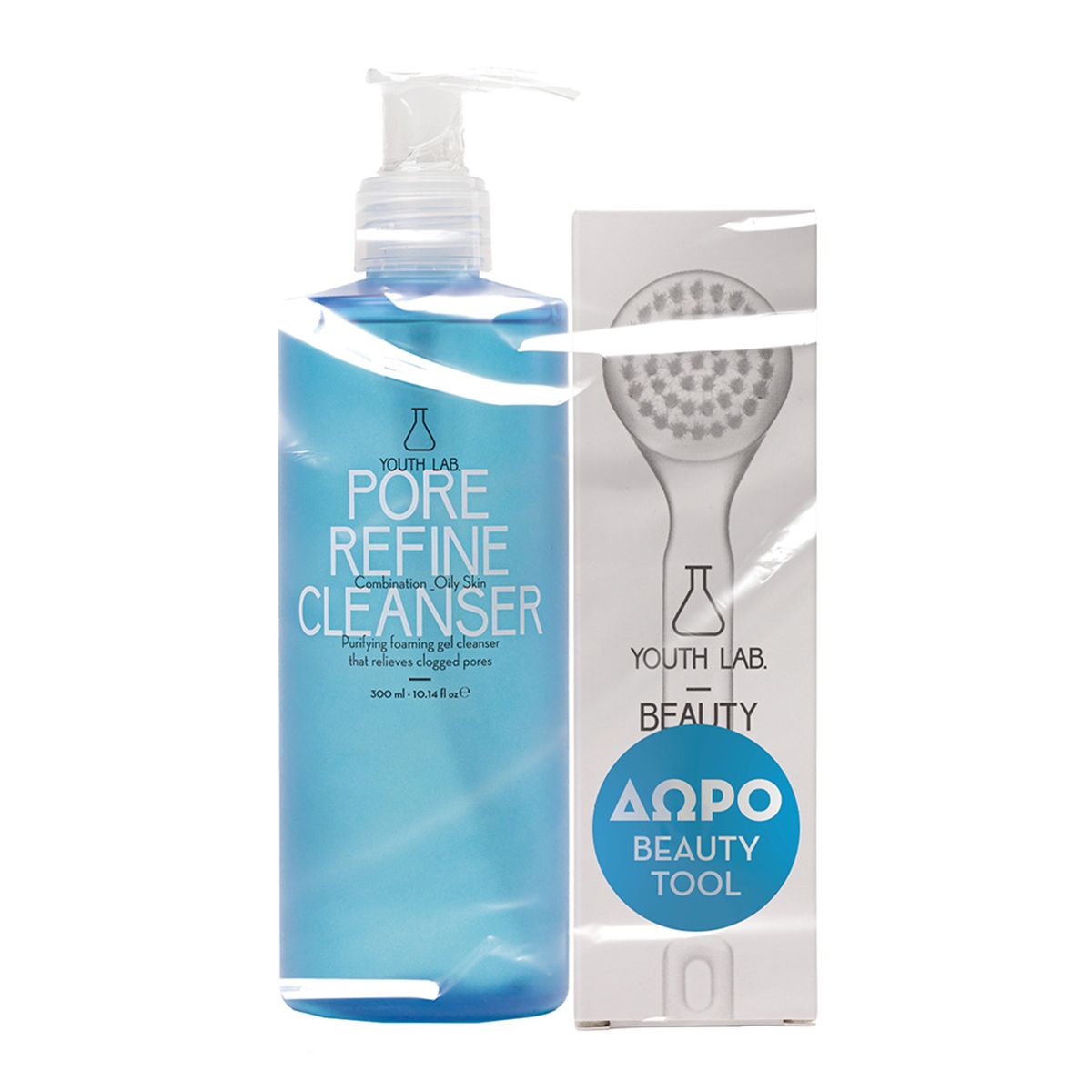 Blaues Flaschen-Set mit Pumpe, weißer Bürste und Karton. Aufschrift: PORE REFINE CLEANSER, YOUTH LAB. Beauty Tool.
