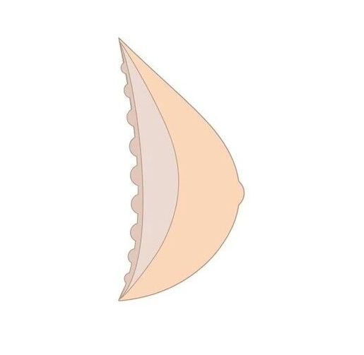 Brustprothese im Profil. Hautfarben, tropfenförmig. Seite mit kleinen, runden Erhebungen.