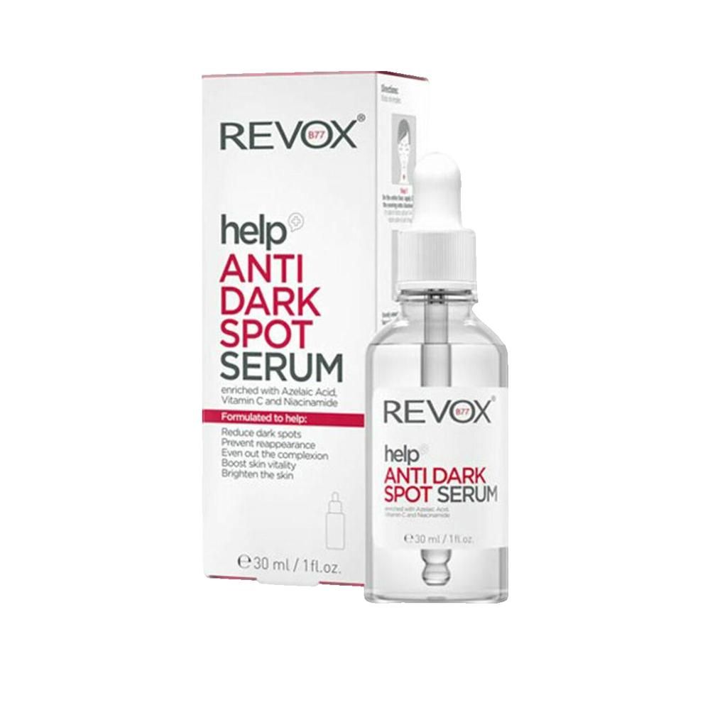 Serumflasche und Schachtel. Aufschrift: REVOX help ANTI DARK SPOT SERUM. Enthält Azelainsäure, Vitamin C und Niacinamid. 30 ml.