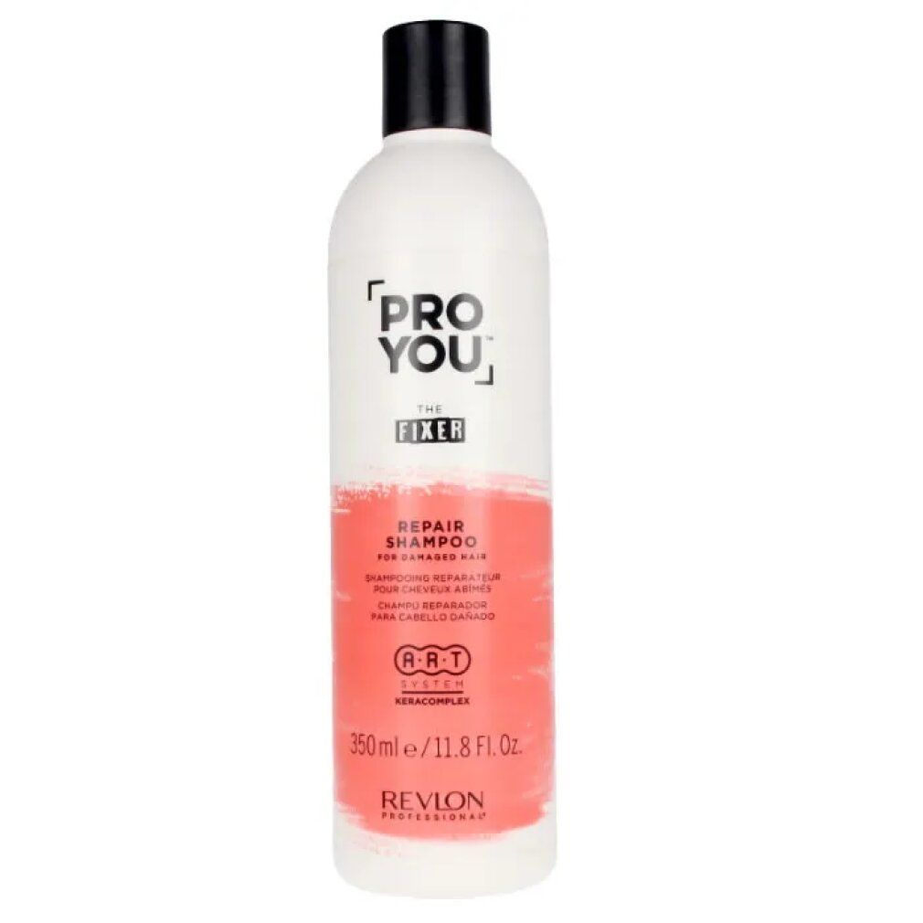 Weiße Flasche mit schwarzem Deckel. Aufschrift: PRO YOU THE FIXER REPAIR SHAMPOO. Revlon-Logo und Text in Rot.
