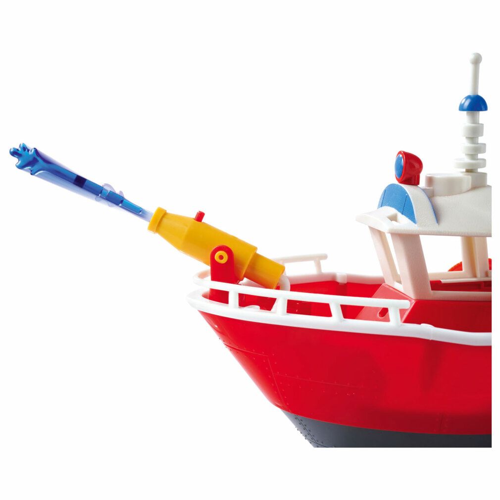 Rotes Spielzeugboot mit gelbem Wasserwerfer. Blaue Düse. Weißer Aufbau. Detailansicht.