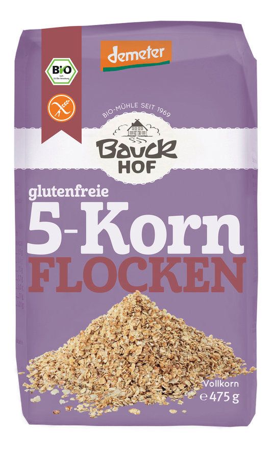 Bauckhof 5-Korn Flocken glutenfrei Packung mit einem Haufen Flocken.