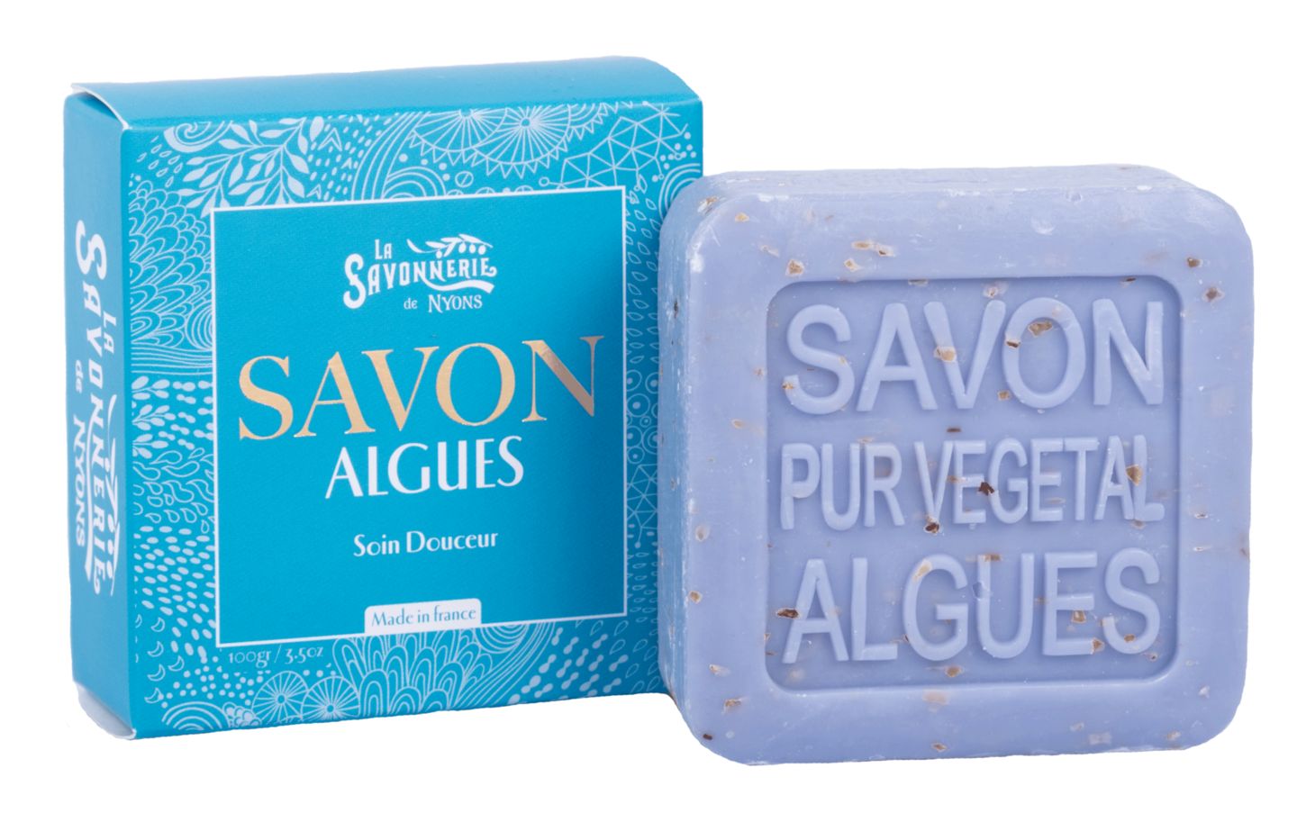 Türkisblaue Schachtel und lilafarbene Seife. Seife mit Schriftzug "Savon Pur Végétal Algues".