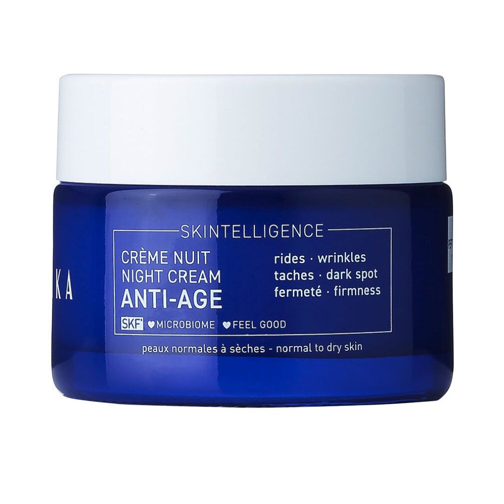 Blauer Tiegel mit weißem Deckel. Aufschrift: Skintelligence, Crème Nuit Night Cream Anti-Age. Für normale bis trockene Haut. Enthält SKF, Microbiome, Feel Good.