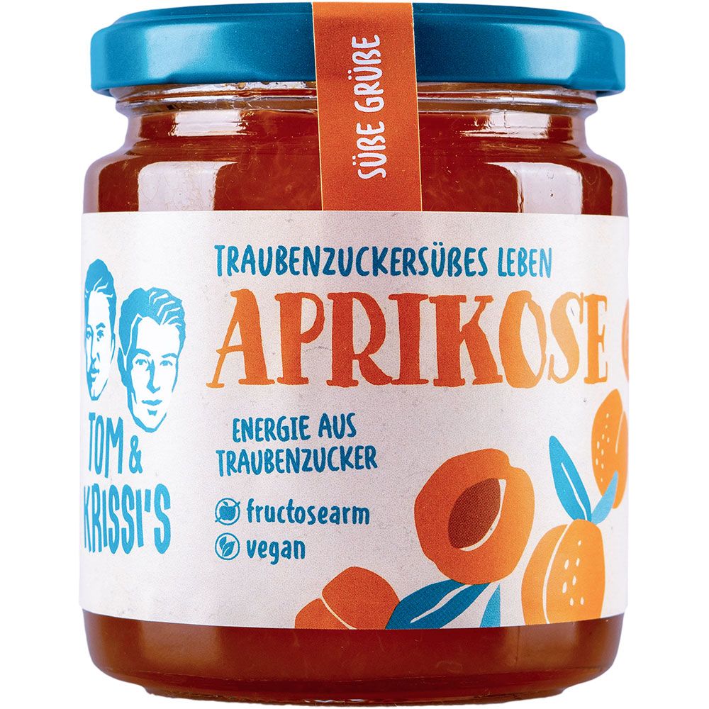 Glas mit Aprikosenmarmelade. Etikett mit "Aprikose", "Tom & Krissi's" und weiteren Texten. Vegan und fructosearm.