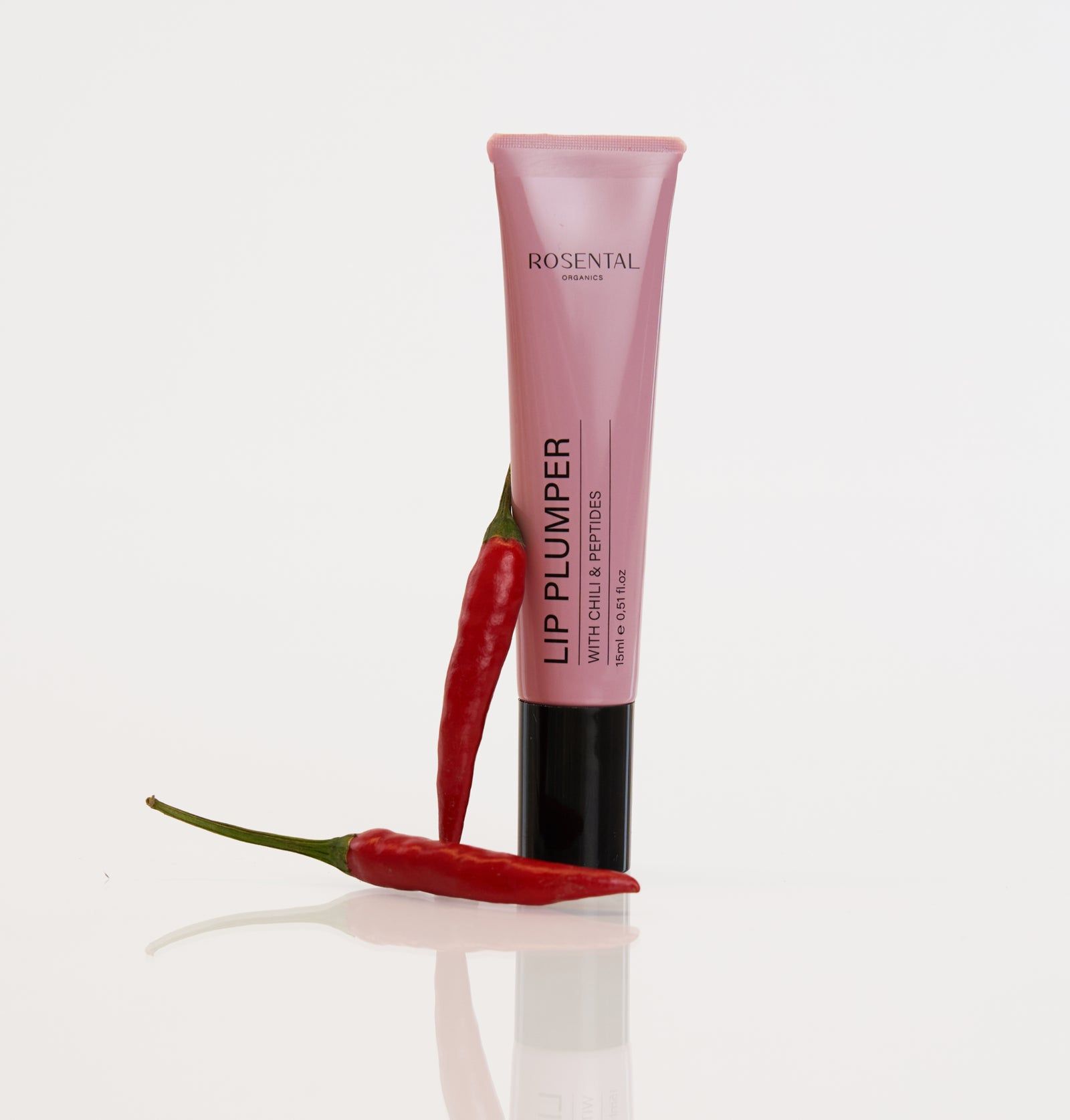 Rosa Tube mit roten Chilischoten. Aufschrift: LIP PLUMPER WITH CHILI & PEPTIDES. Marke: Rosental Organics.