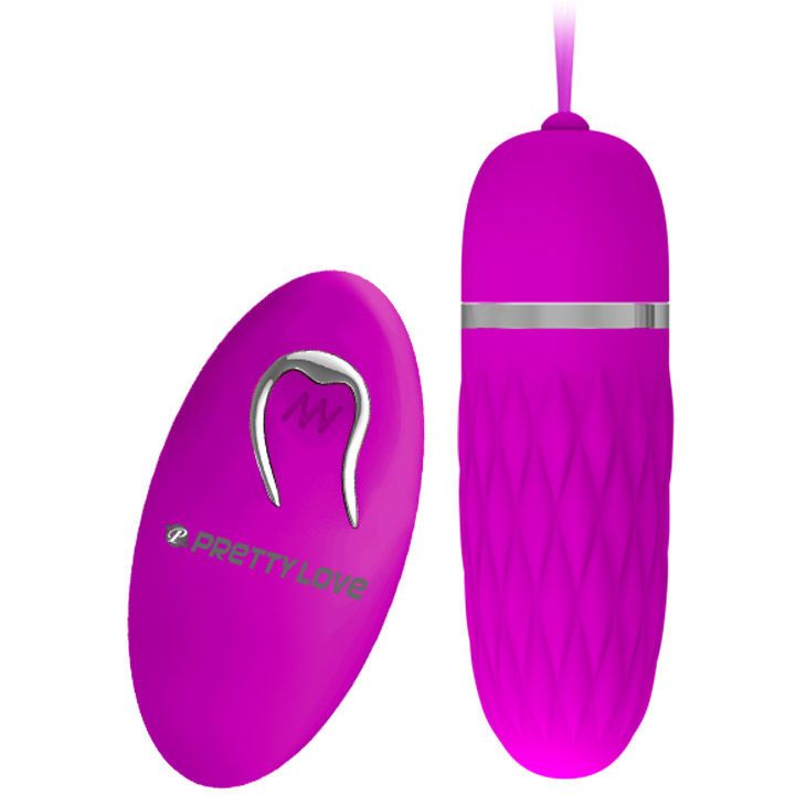 Pinkfarbener Vibrator und Fernbedienung. Der Vibrator hat eine geriffelte Oberfläche und einen silbernen Ring. Die Fernbedienung hat ein Logo.