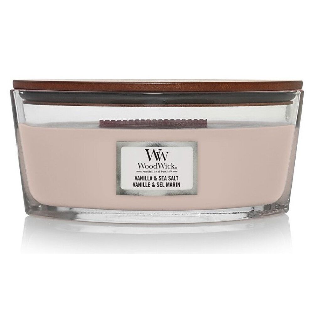Ellipsenförmige Kerze mit Deckel. Glasbehälter mit rosa Wachs. Aufkleber mit Markennamen und Produktbezeichnung.