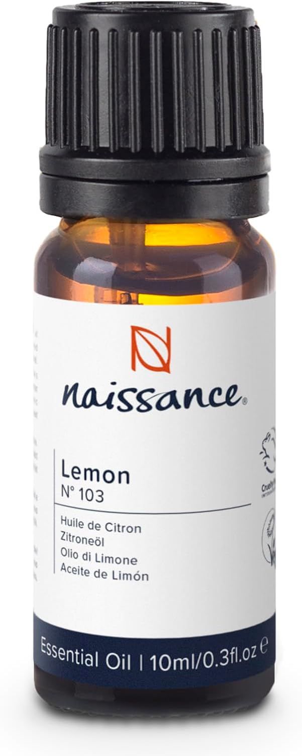 Braune Glasflasche mit schwarzem Deckel. Etikett mit Text: Naissance, Lemon, Essential Oil. 10ml.