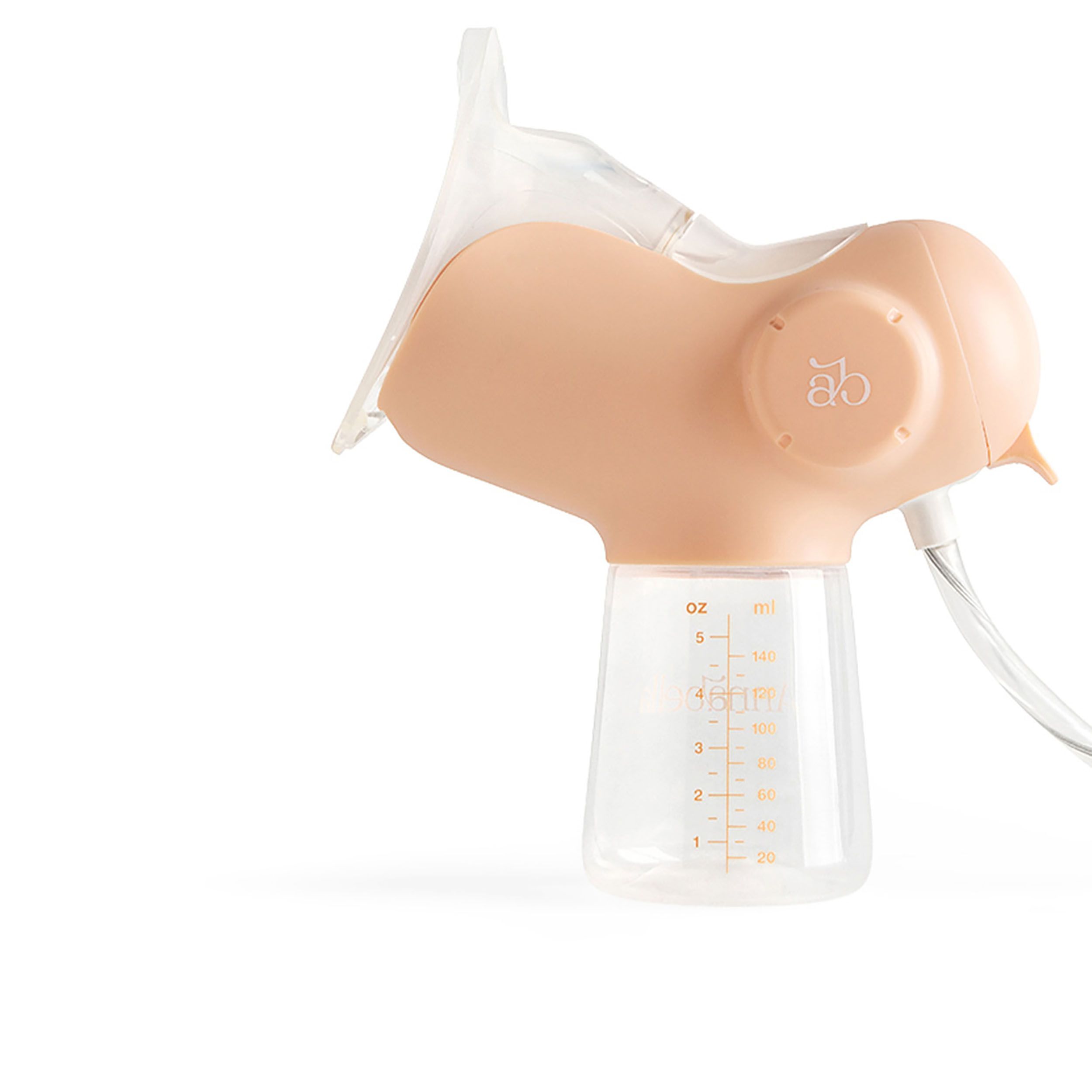 Nahaufnahme einer elektrischen Milchpumpe. Beige und transparente Teile. Skala zur Messung des Volumens.