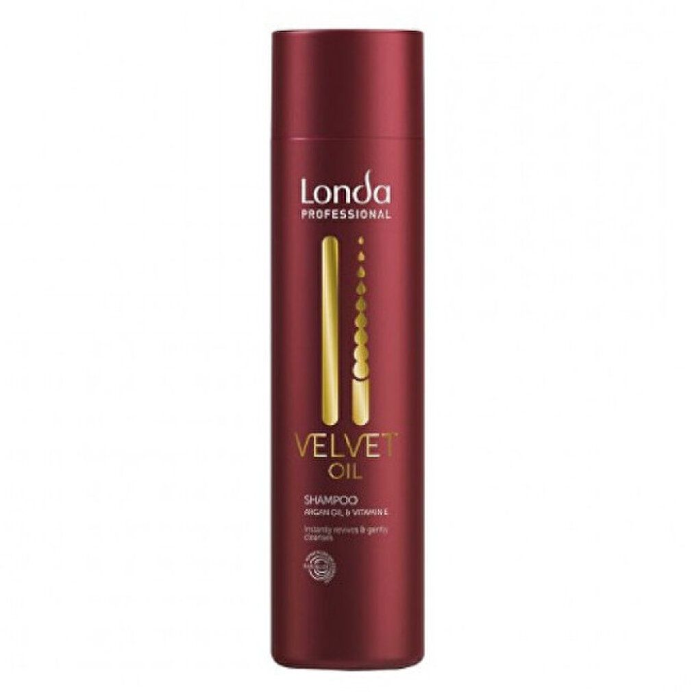 Rote Shampoo-Flasche. Goldfarbene Schrift: Velvet Oil, Shampoo. Marke: Londa Professional. Enthält Arganöl und Vitamin E. Rundes Qualitätssiegel.