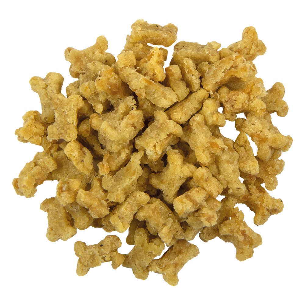 Draufsicht auf einen Haufen getreidefreier Hundesnacks in Knochenform. Helle Farbe.