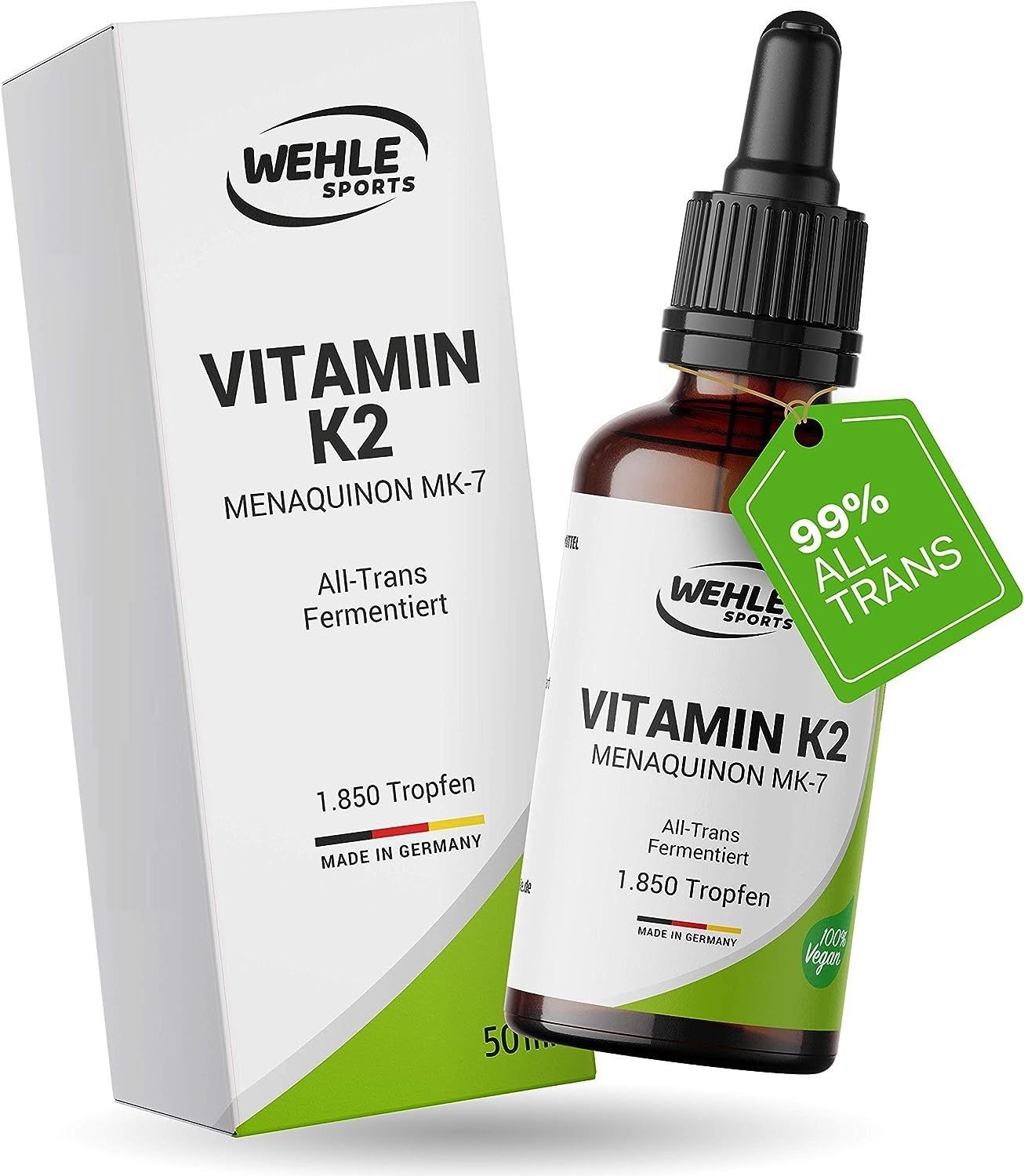 Braune Glasflasche mit Tropfer und Karton. Aufschrift: Vitamin K2, Menaquinon MK-7. Grünem Anhänger: 99% All Trans.