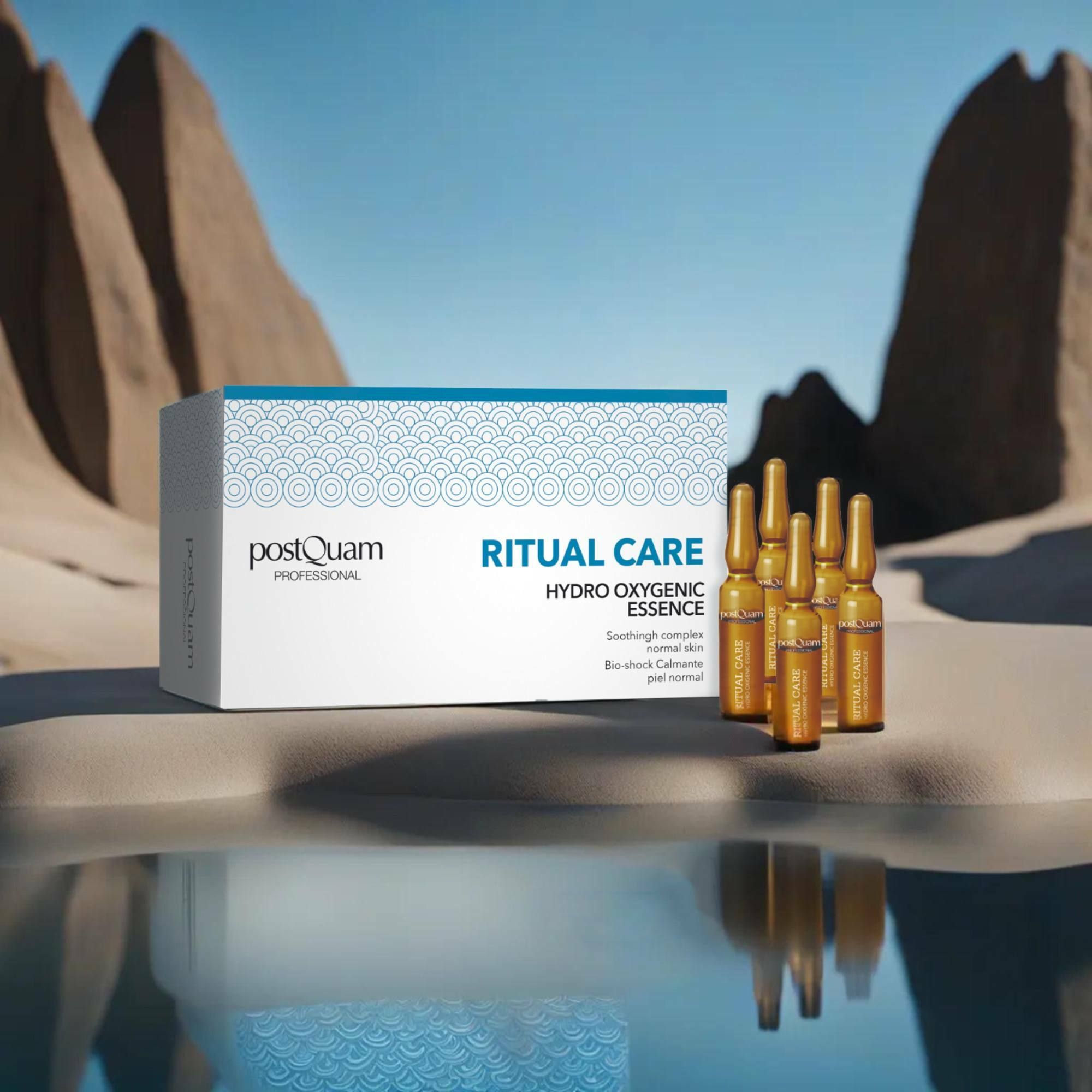 Packung mit Ampullen vor einer Wüstenlandschaft. Aufschrift 'Postquam Professional', 'Ritual Care Hydro Oxygenic Essence'.
