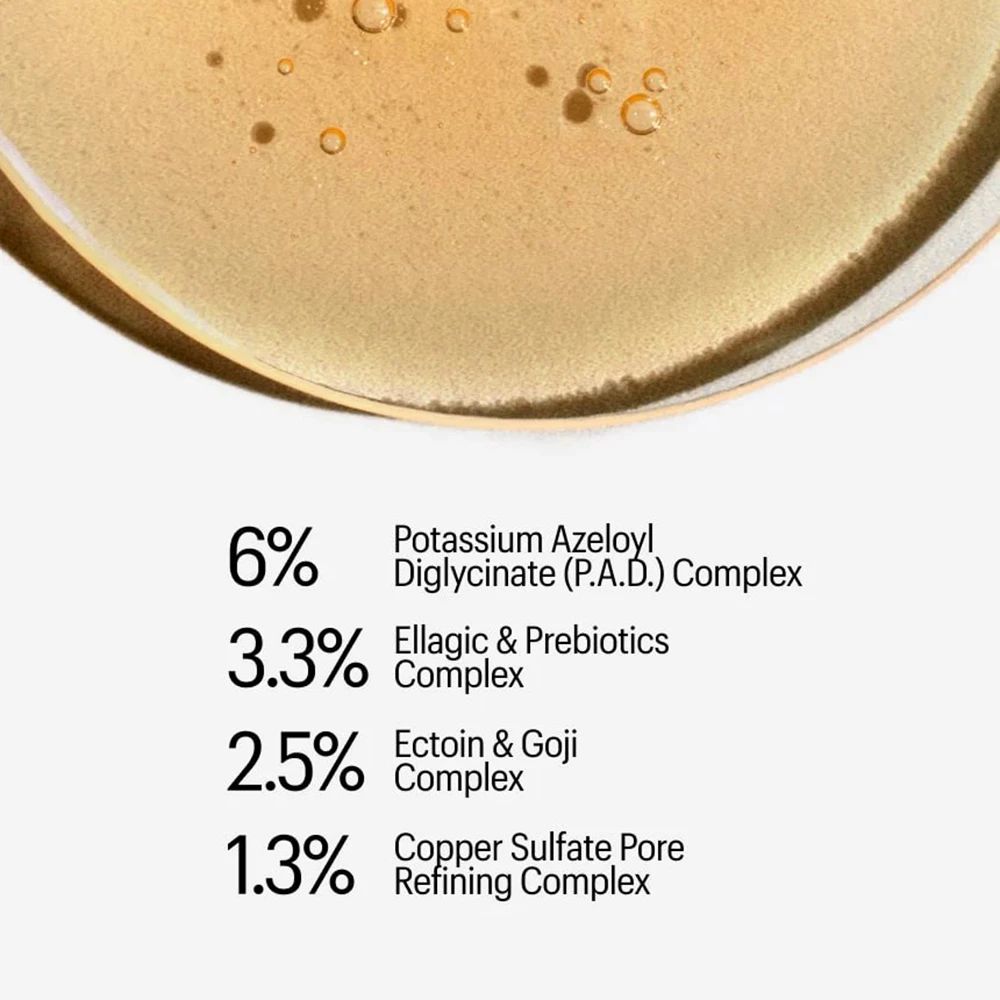 Nahaufnahme einer goldenen Flüssigkeit mit Prozentangaben und Inhaltsstoffen wie Ellagic & Prebiotics Complex.