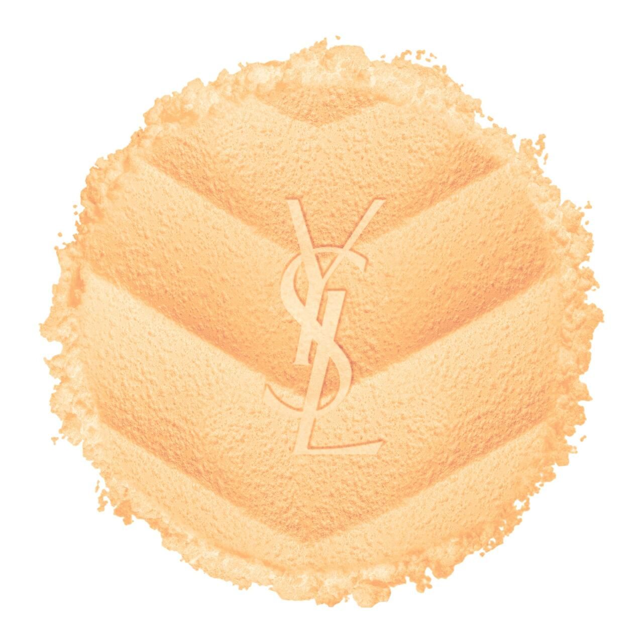 Runder Puder-Applikator mit geprägtem YSL-Logo und Steppmuster. Beige Farbe.